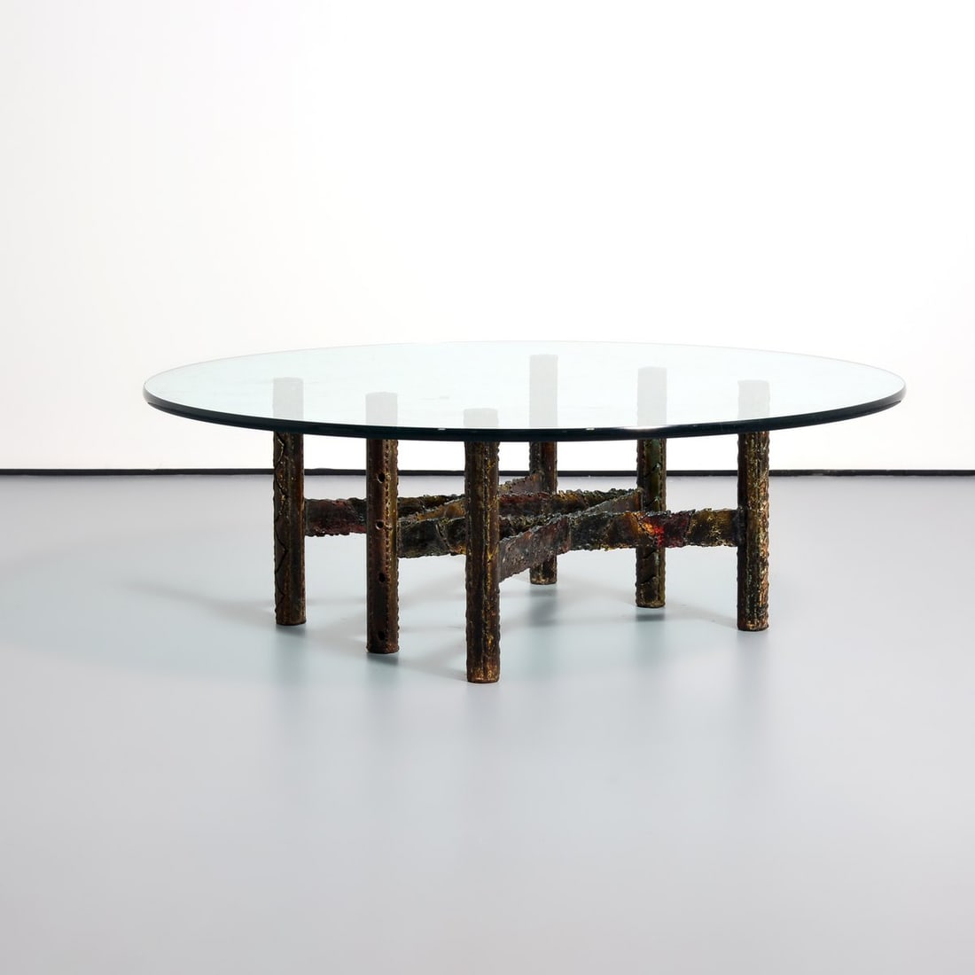 Paul Evans Coffee Table: Artist/Designer; Manufacturer: Paul Evans (American, 1931-1987), Paul Evans Studio (USA) Marking(s); notes: signed Materials: welded steel, glass Dimensions (H, W, D): 16.25"h, 47"dia, .75" thick Addi