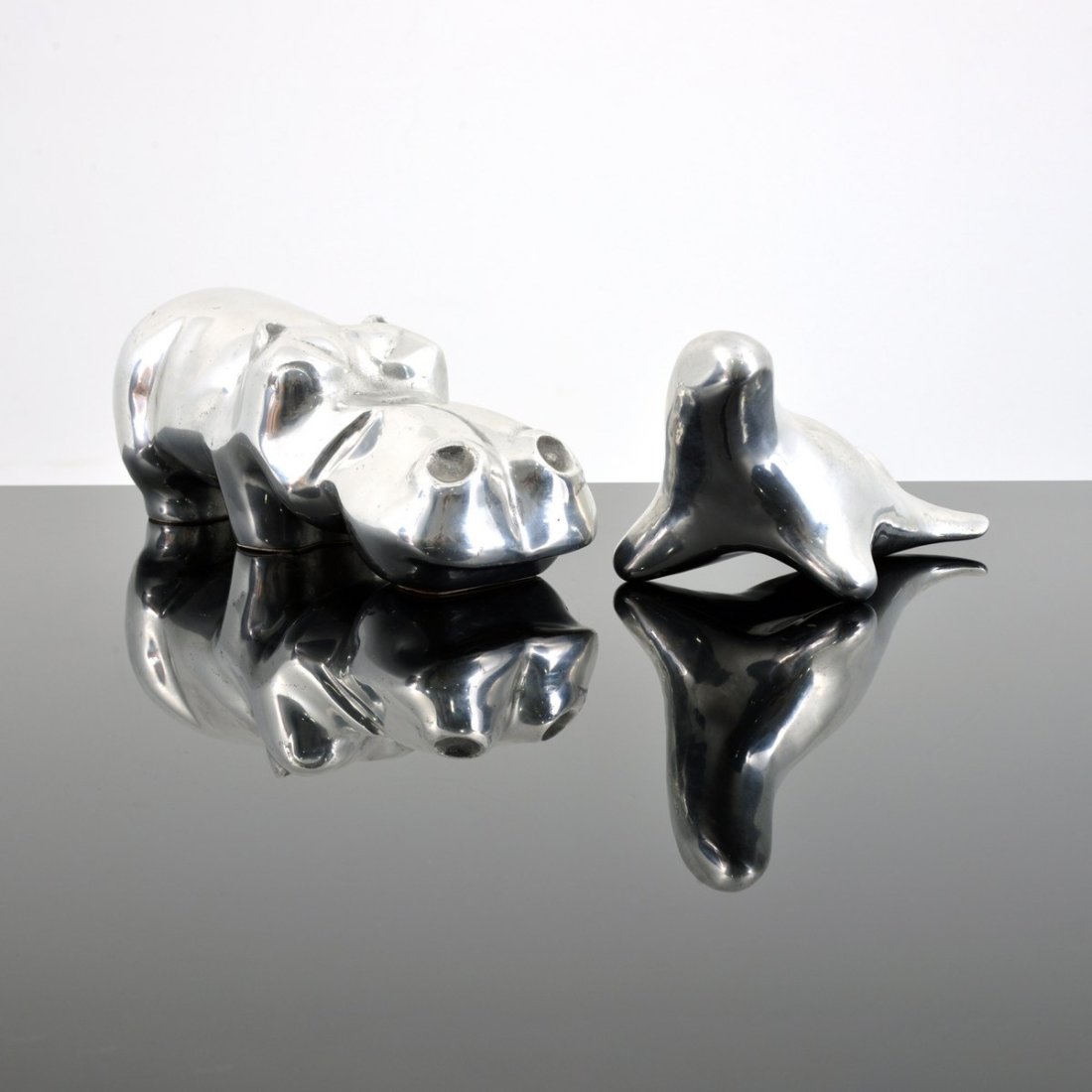 2 David Parkin Animal Sculptures: Hippo & Seal: Artist/Designer; Manufacturer: David Parkin (American, 20th Century) Marking(s); notes: hippo: signed; ed. 388/450; seal: marking(s), 399 Materials: aluminum Dimensions (H, W, D): hippopotamus: 5.5"h,