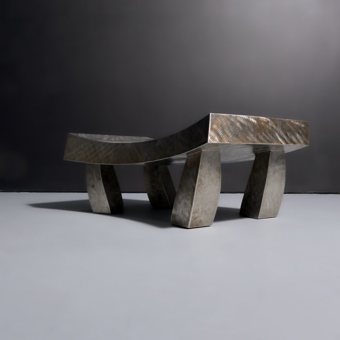 Paul Freundt AZTECA Bench: Artist/Designer; Manufacturer: Paul Freundt (American, 20th Century) Marking(s); notes: no marking(s) apparent Materials: aluminum Dimensions (H, W, D): 16"h, 42.25"w, 26"d Additional Information: Lot