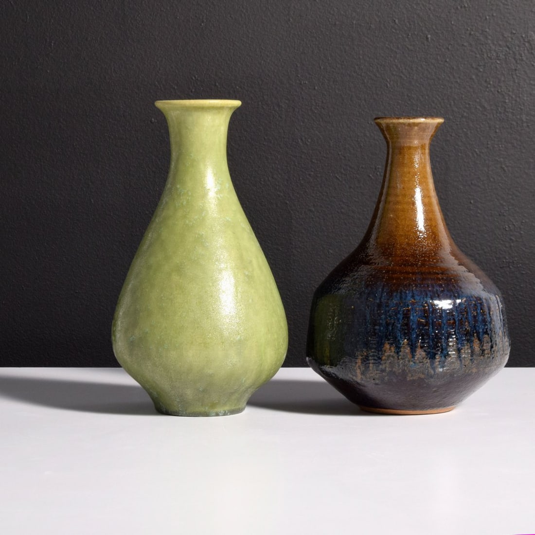Oscar Bucher Vase & Bulldog Pottery Vase: Artist/Designer; Manufacturer: Oscar Bucher (Swiss/American, 20th Century); Bulldog Pottery (USA) Marking(s); notes: signed, marking(s) Materials: ceramic Dimensions (H, W, D): 8.75"h, 6.5"dia Additio
