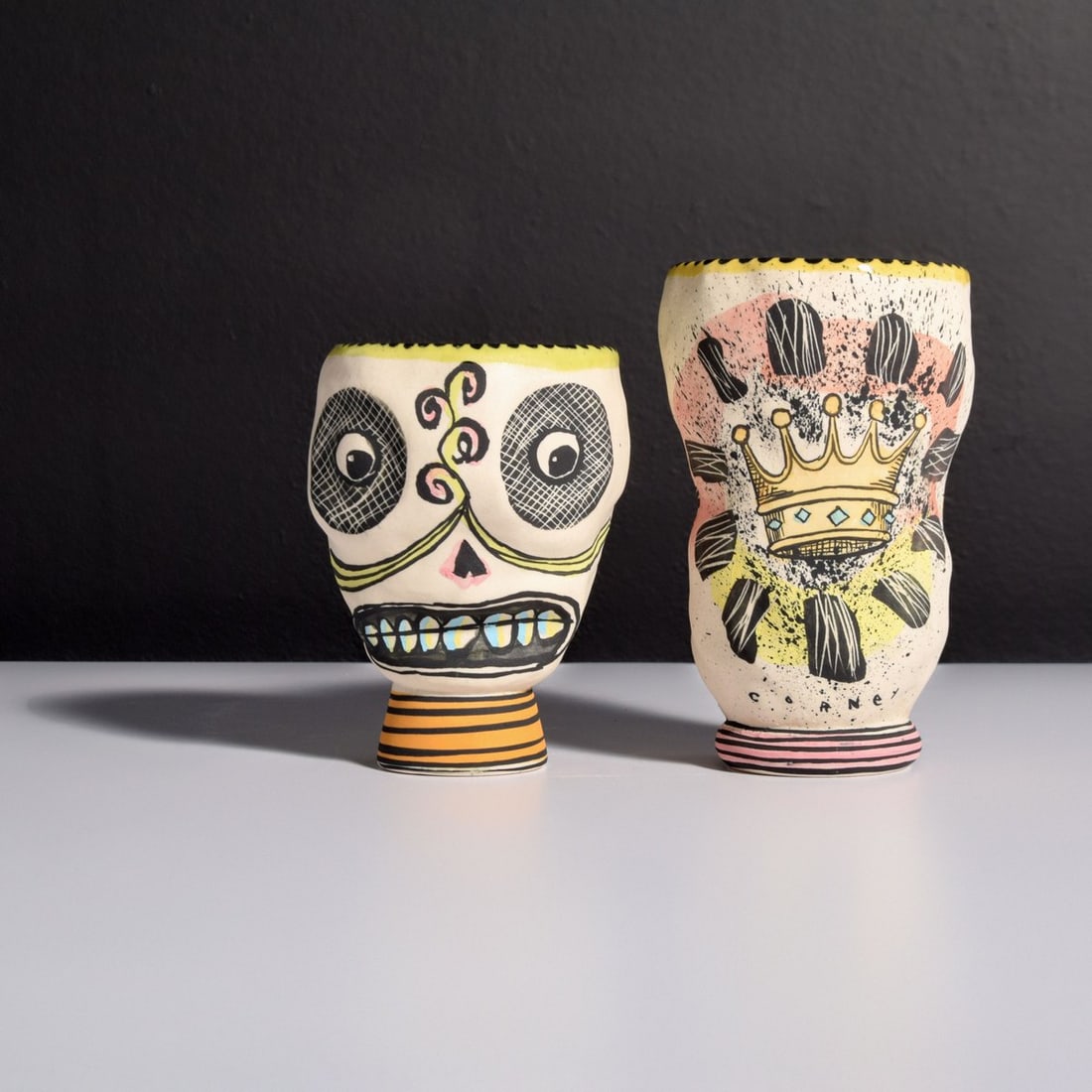2 Michael Corney Cups / Vessels: Artist/Designer; Manufacturer: Michael Corney (American, 20th Century) Marking(s); notes: signed, marking(s); 2001 Materials: ceramic Dimensions (H, W, D): largest: 5.25"h, 3.25"dia Additional Informa