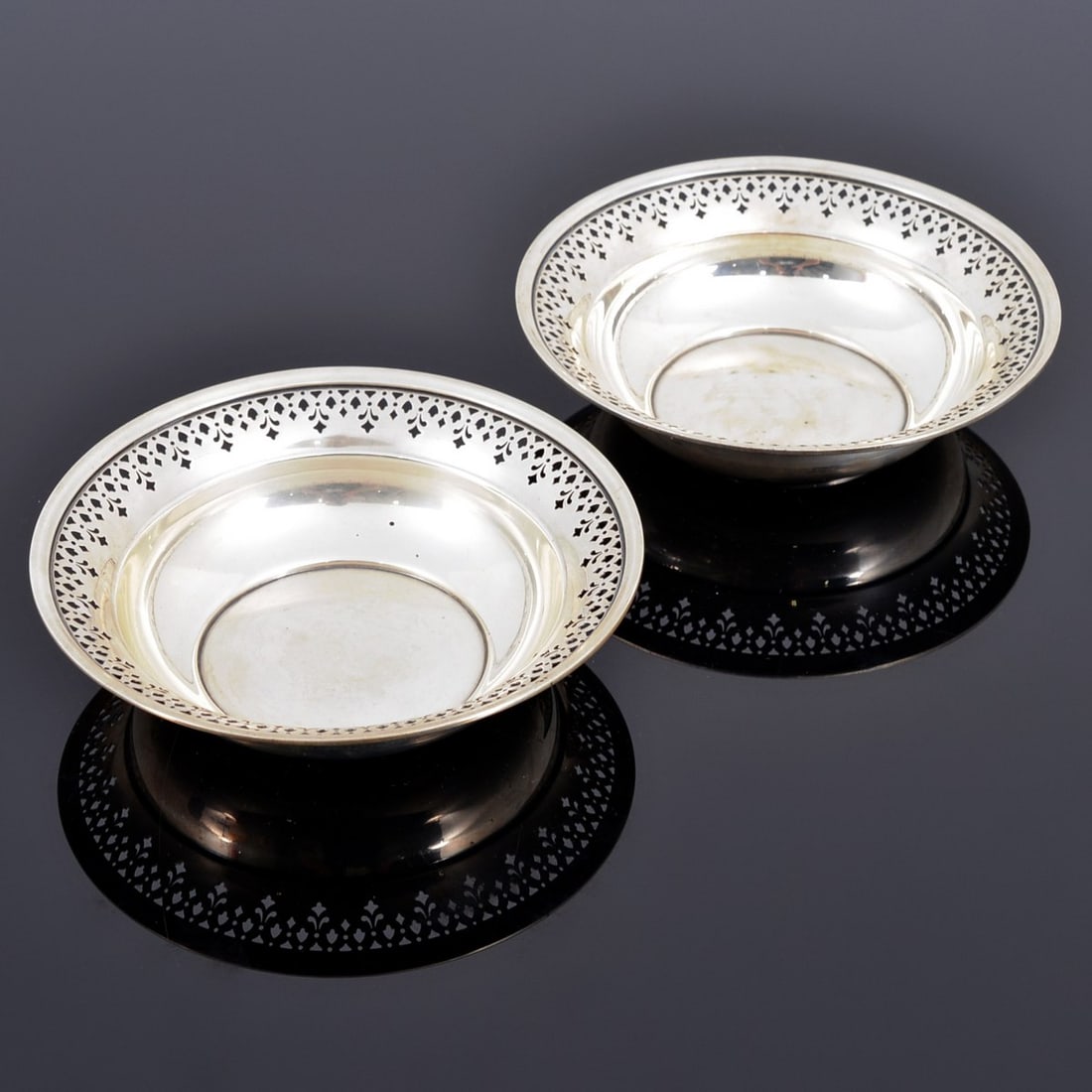 Pair of Tiffany & Co. Sterling Silver Bowls: Artist/Designer; Manufacturer: Tiffany & Co. (USA) Marking(s); notes: signed, sterling imprint, marking(s) Country of origin; materials: sterling silver Dimensions (H, W, D): 1.5"h, 6.5"dia; 12.52 Tro