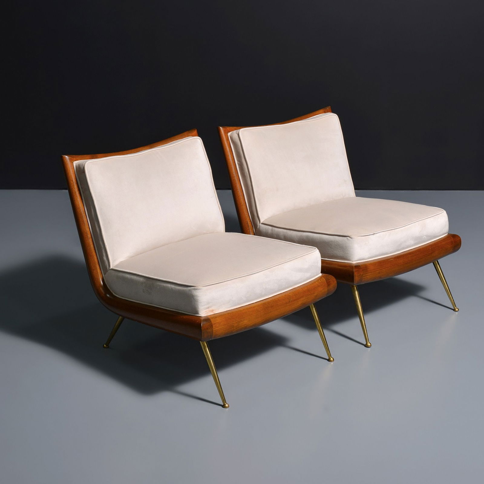 Pair of T.H. Robsjohn-Gibbings Slipper Lounge Chairs: Artist/Designer; Manufacturer: T.H. Robsjohn-Gibbings (American, 1905-1976); Widdicomb (USA)Marking(s); notes: no marking(s) apparentMaterials: birch, brass, upholstery