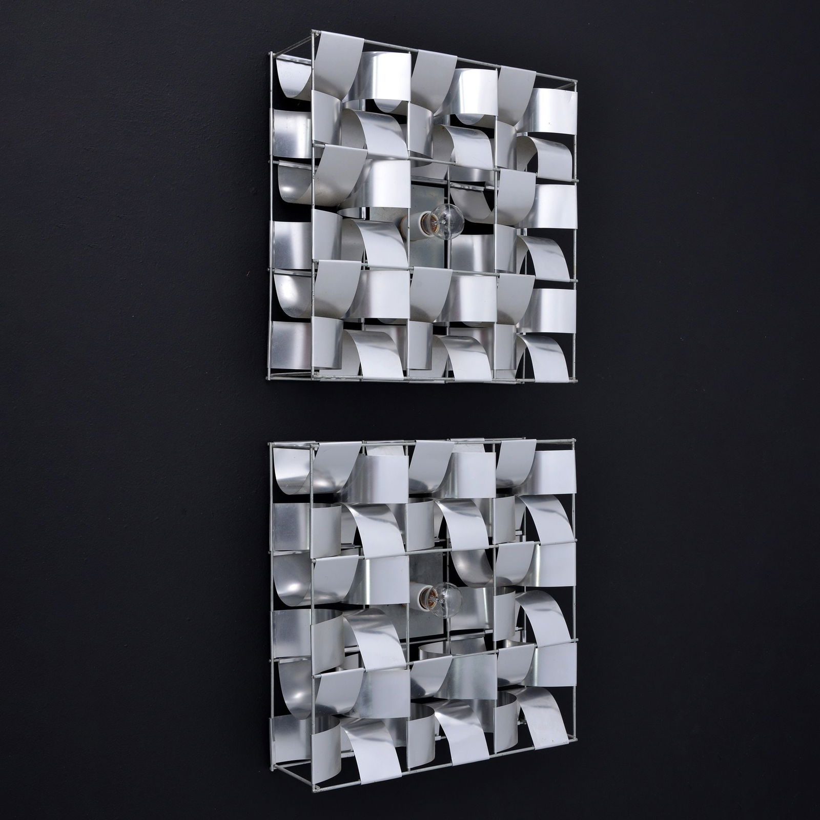 Pair of Max Sauze Sconces: Artist/Designer; Manufacturer: Max Sauze (French, b. 1933)Marking(s); notes: Max Sauze labelMaterials: aluminum, zinc-plated steelDimensions (H,