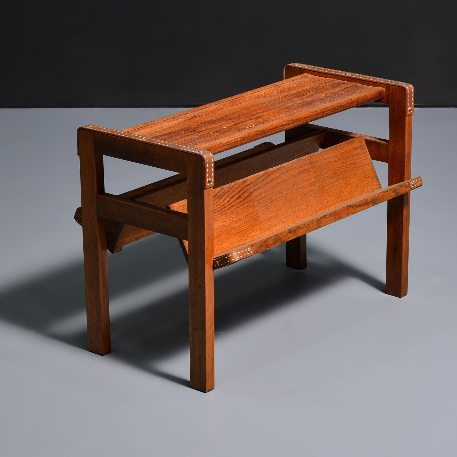 Jacques Adnet Encyclopedia / Magazine Stand: Artist/Designer; Manufacturer: Jacques Adnet (French, 1900-1984)Marking(s); notes: no marking(s) apparentMaterials: oak, leatherDimensions (H, W, D): 22&quo