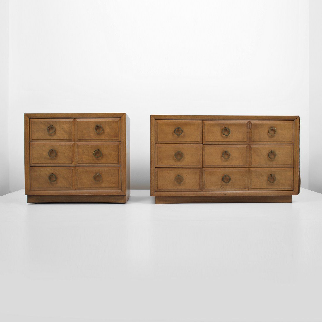 Pair of T.H. Robsjohn-Gibbings Dressers: Designer & Manufacturer: T.H. Robsjohn-Gibbings; Widdicomb Markings: marked Country of Origin & Materials: USA; wood, metal Additional Information & Circa: Pair of dressers by T.H. Robsjohn-Gibbings c