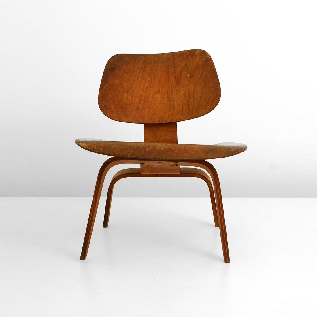 Charles & Ray Eames "LCW", Evans Products: Designer & Manufacturer: Charles & Ray Eames; Evans Products/Herman Miller Markings: marked Country of Origin & Materials: USA; wood Additional Information & Circa: Early "LCW" (lounge chair wood) by