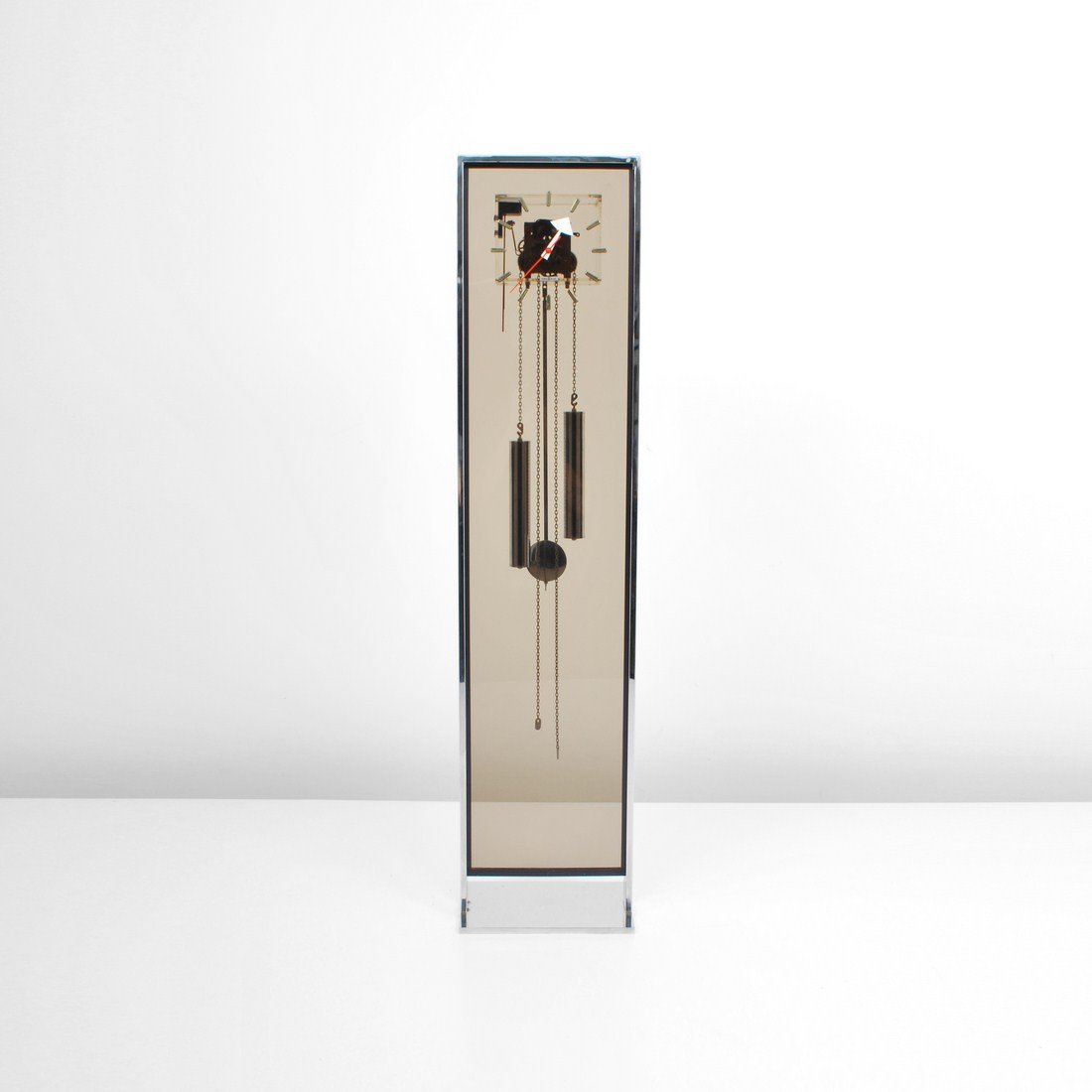 George Nelson & Associates Floor Clock: Designer & Manufacturer: George Nelson & Associates; Howard Miller Clock Co. Markings: marked Country of Origin & Materials: USA; smoked acrylic, chrome, other Additional Information & Circa: Modernis
