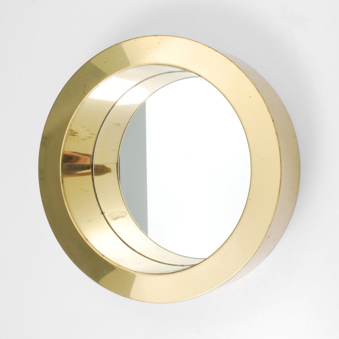 Curtis Jere "Porthole" Mirror: Designer & Manufacturer: Curtis Jere; Artisan House Markings: marked; dated Country of Origin & Materials: USA; mirror, brass Additional Information & Circa: "Porthole" mirror by Curtis Jere 1976 Dime