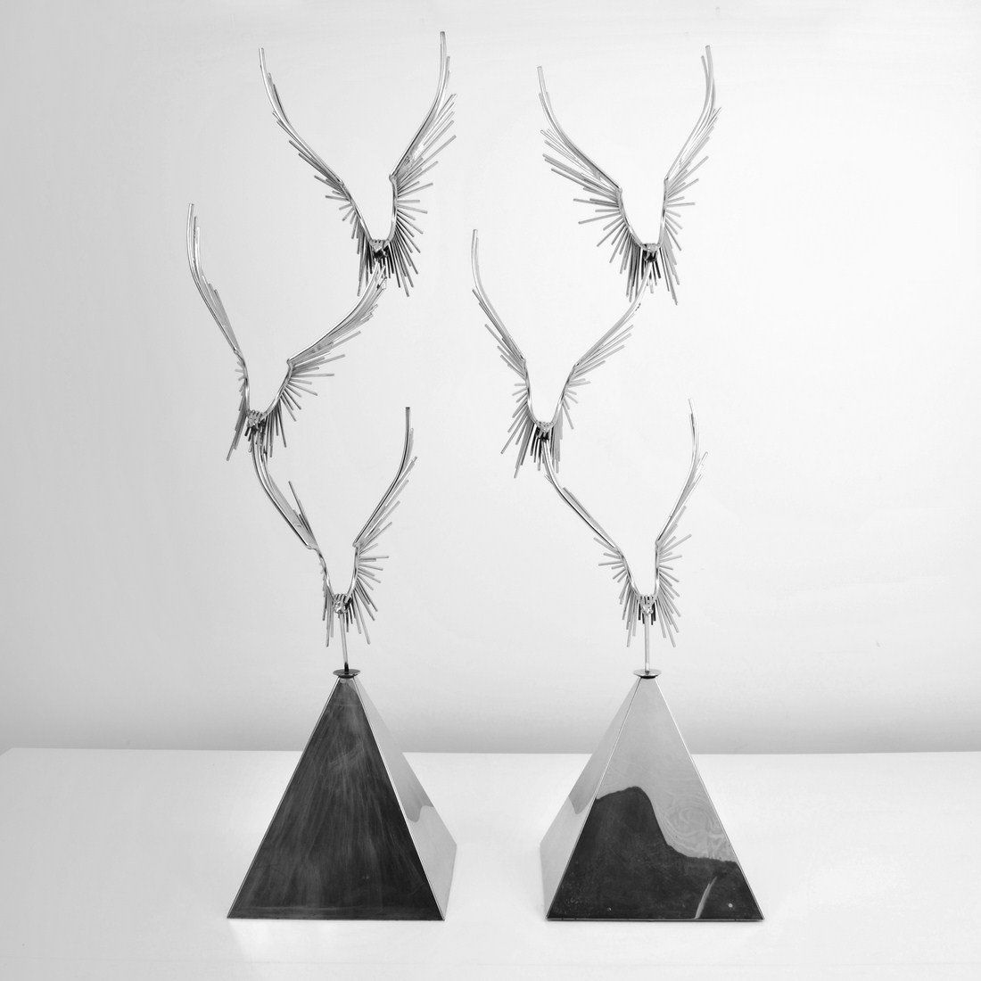Pair of Large Curtis Jere Bird Sculptures: Designer & Manufacturer: Curtis Jere; Artisan House Markings: none Country of Origin & Materials: USA; chromed metal Additional Information & Circa: Monumental pair of birds in flight by Curtis Jere c