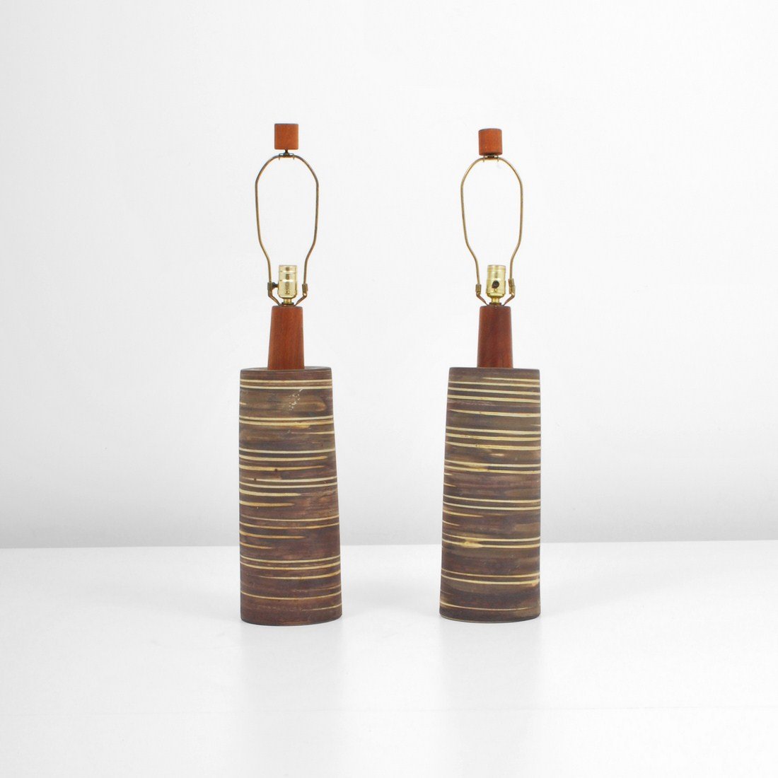 Pair of Gordon & Jane Martz Lamps: Designer & Manufacturer: Gordon & Jane Martz Markings: marked Country of Origin & Materials: USA; wood, ceramic Additional Information & Circa: Pair of modern lamps by Gordon & Jane Martz c. 1960 Dime