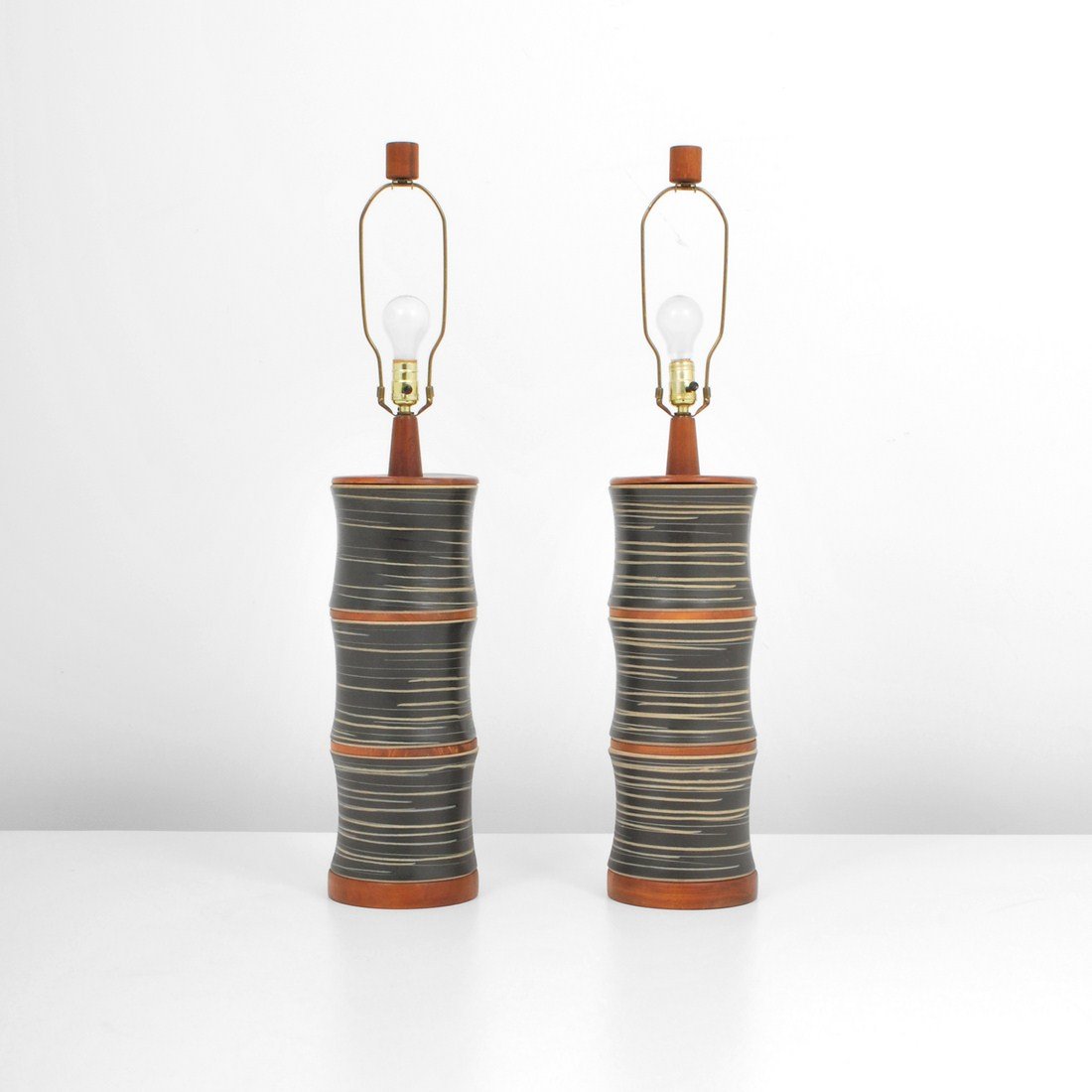 Pair of Gordon & Jane Martz Lamps: Designer & Manufacturer: Gordon & Jane Martz Markings: none Country of Origin & Materials: USA; wood, ceramic Additional Information & Circa: Tall pair of modern lamps by Gordon & Jane Martz c. 1960 D