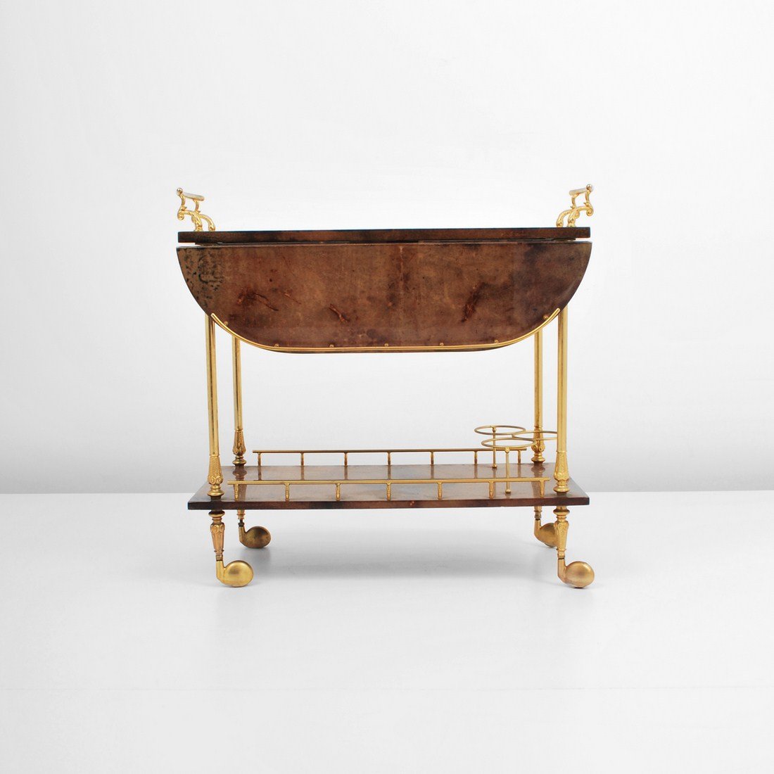 Aldo Tura Tea Cart: Designer & Manufacturer: Aldo Tura Markings: none Country of Origin & Materials: Italy; lacquered goatskin, metal Additional Information & Circa: Folding bar cart by Aldo Tura c. 1955 (Key Word Search