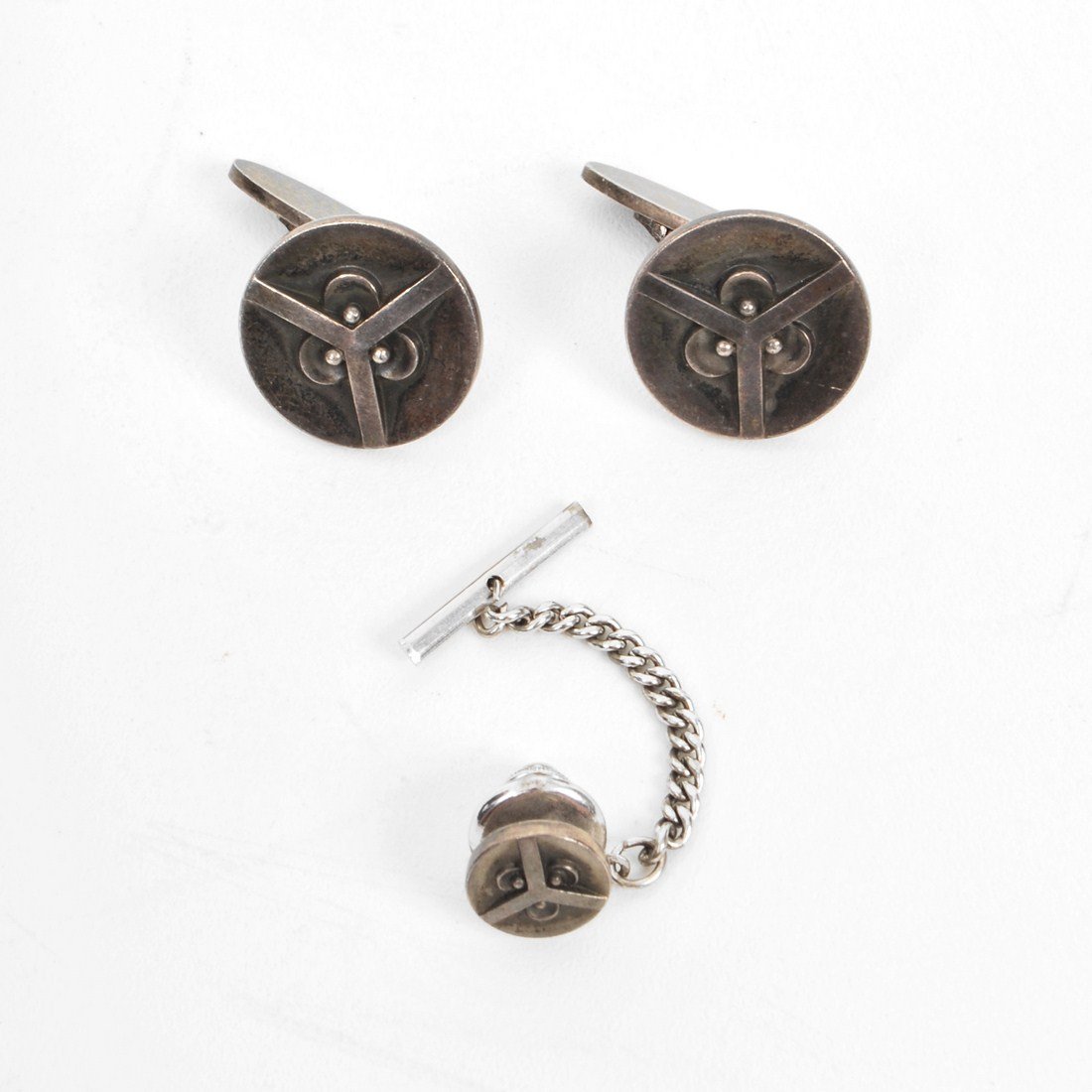 Georg Jensen Tie Tac & Cuff Links: Designer & Manufacturer: Georg Jensen Markings: marked Country of Origin & Materials: Denmark; sterling silver Additional Information & Circa: Sterling silver tie tac and cuff links by Georg Jensen; c