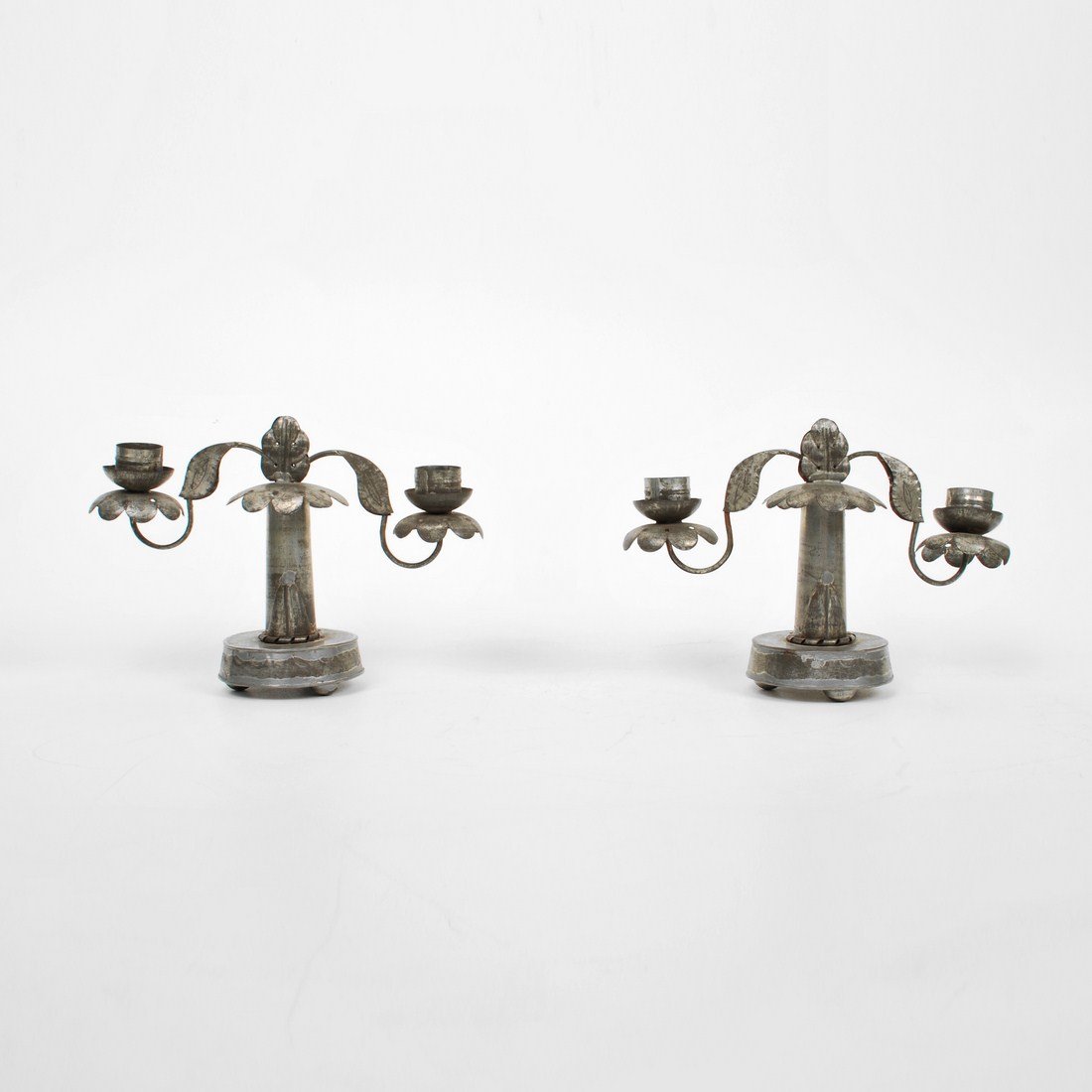 Pair of William Spratling Candlesticks: Designer & Manufacturer: William Spratling Markings: marked Country of Origin & Materials: Mexico; tin Additional Information & Circa: Pair of candlesticks by William Spratling c. 1935 (Key Word Searc