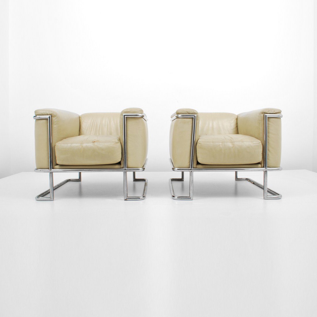 Pair of Club Chairs, Le Corbusier: Designer & Manufacturer: Le Corbusier, Manner of Markings: none Country of Origin & Materials: unknown; chromed metal, leather Additional Information & Circa: Pair of club/lounge chairs in the manner