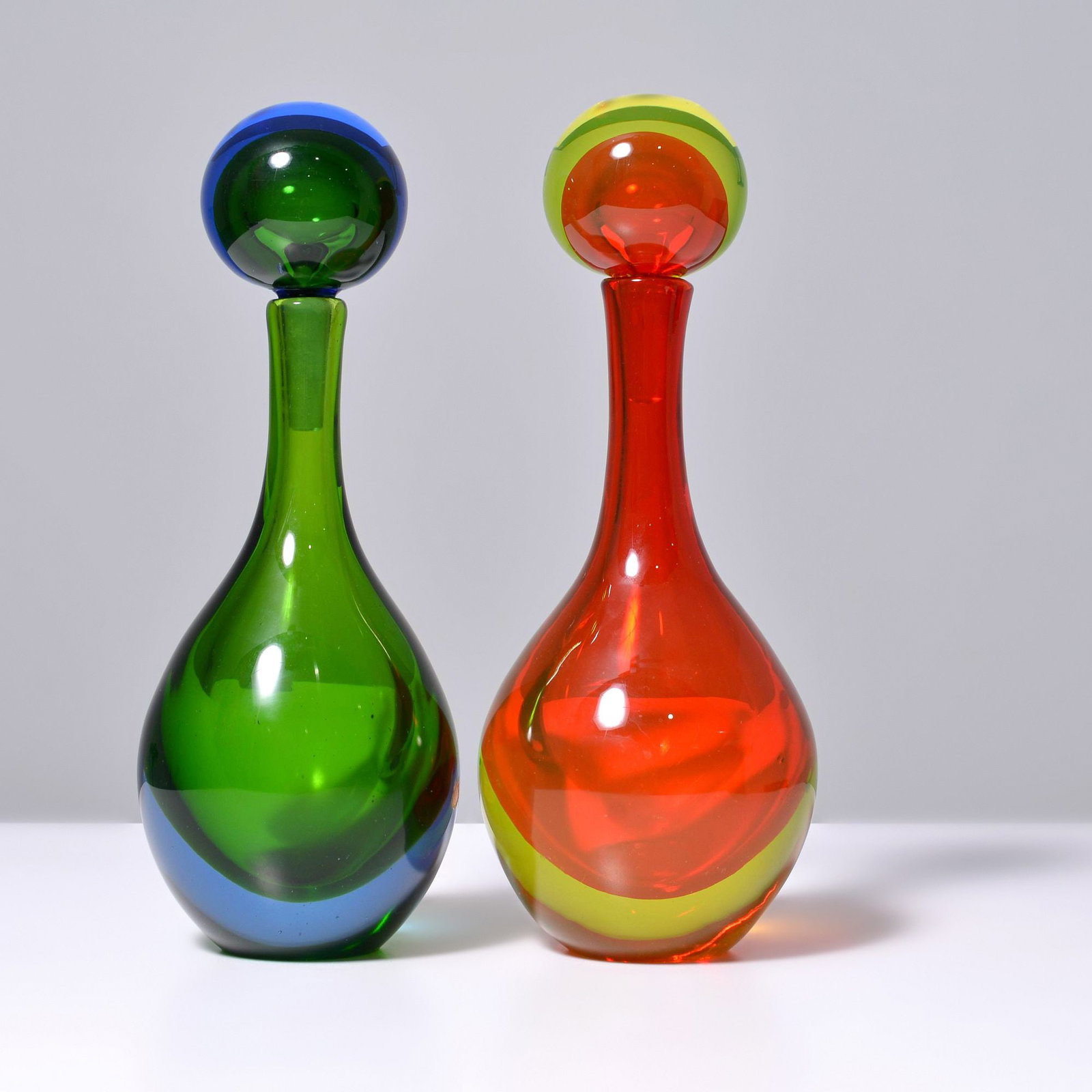 2 Large SOMMERSO Decanters / Bottles, Manner of Cenedese, Murano: Artist/Designer; Manufacturer: Cenedese (Italy), manner of Marking(s); notes: partial label (2) Materials: glass Dimensions (H, W, D): largest: