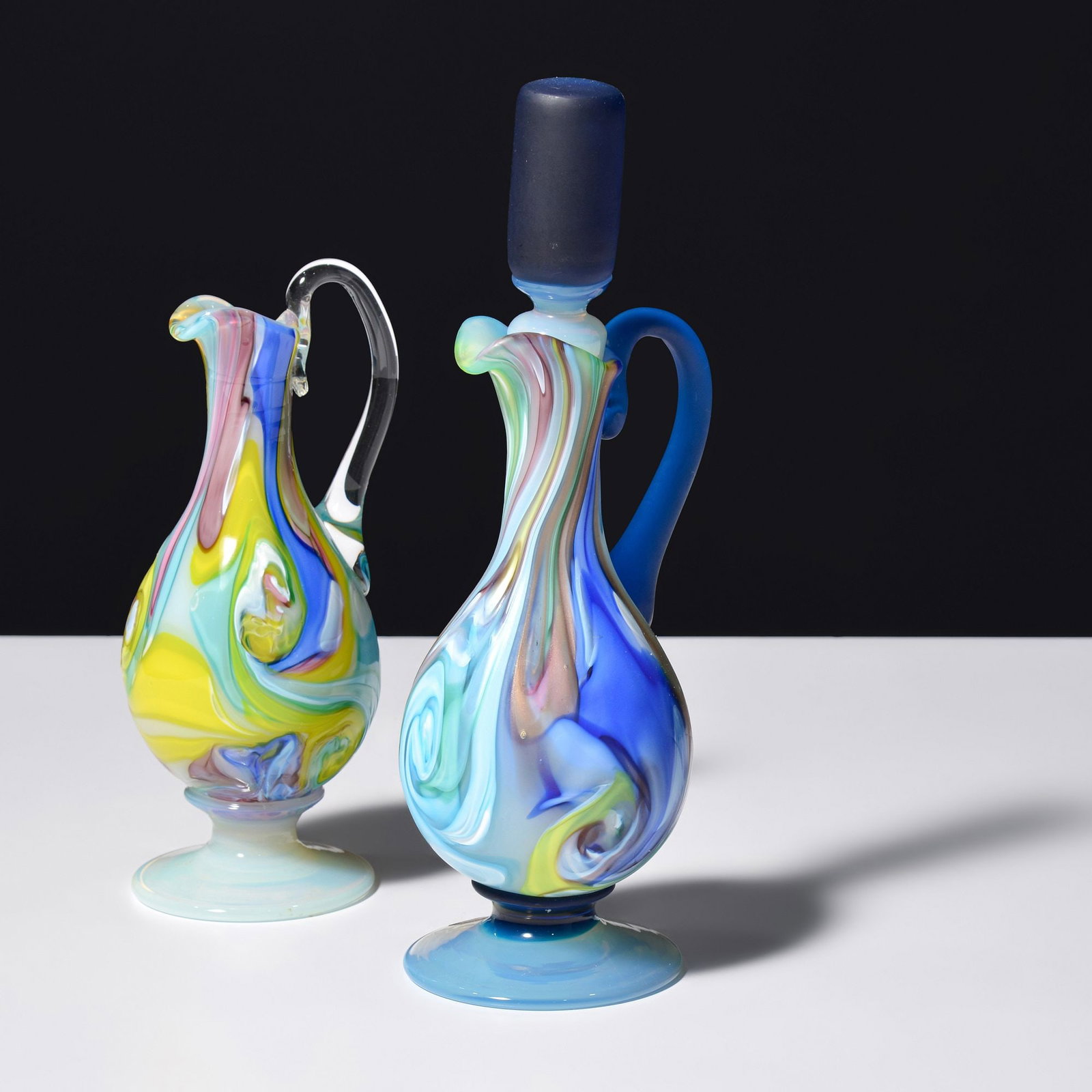 2 Fratelli Toso SMELZ Ewers, Murano: Artist/Designer; Manufacturer: Fratelli Toso (Italy) Marking(s); notes: KB export label (1) Materials: glass Dimensions (H, W, D): largest (with stop