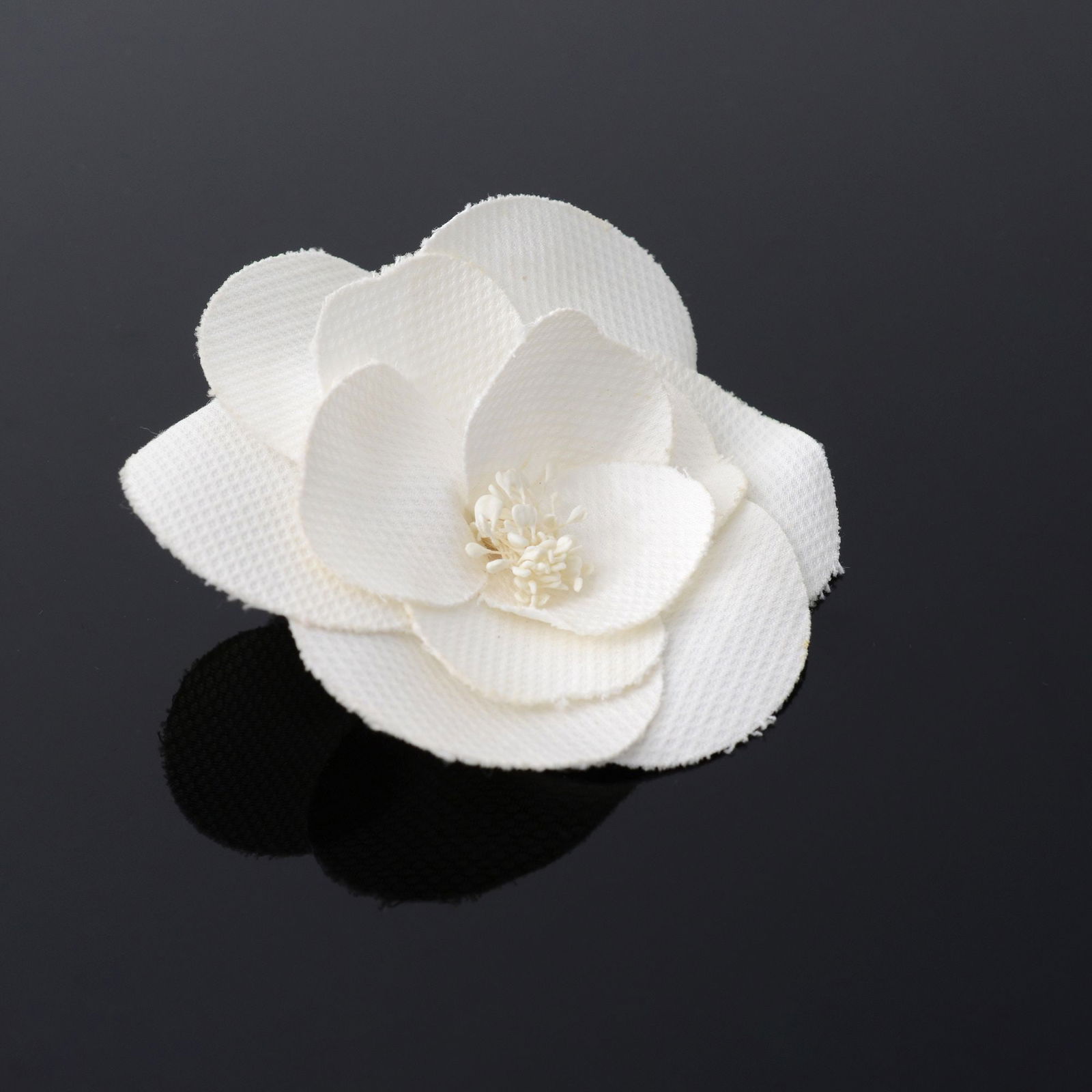 Chanel CAMELLIA Brooch: Artist/Designer; Manufacturer: Chanel (France)Marking(s); notes: Chanel plaqueMaterials: fabric, metalDimensions (H, W, D): 4"h, 4"w