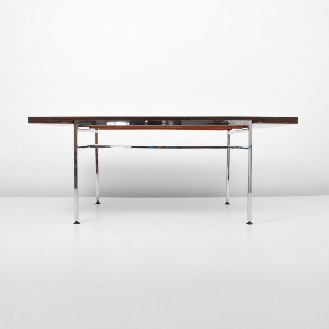 Alain Richard Rosewood Dining Table: Designer & Manufacturer: Alain Richard; Ameublement Meubles Markings: marked Country of Origin & Materials: France; rosewood, chrome Additional Information & Circa: Dining table with rosewood top and