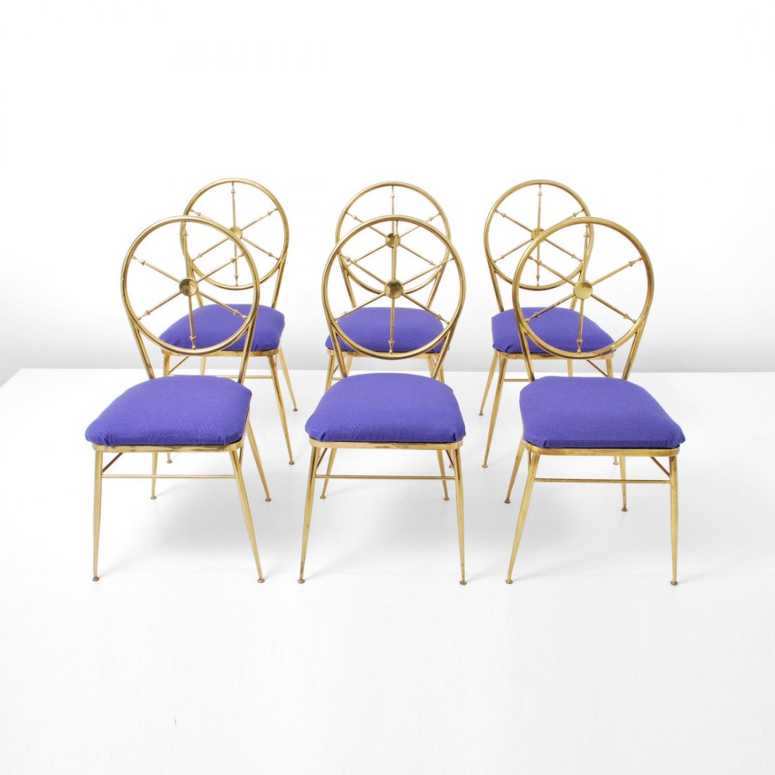 Set of 6 Brass Chairs, Gio Ponti: Designer & Manufacturer: Gio Ponti, Attributed Markings: none Country of Origin & Materials: Italy; brass, upholstery Additional Information & Circa: Set of 6 chairs with wheel design backs attributed