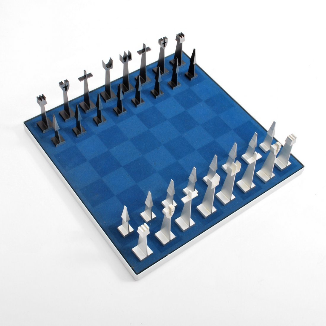 Austin Cox Modernist Chess Set: Designer & Manufacturer: Austin Cox Enterprises for Alcoa Markings: marked Country of Origin & Materials: USA; aluminum, wood, other Additional Information & Circa: Modernist aluminum chess board and 
