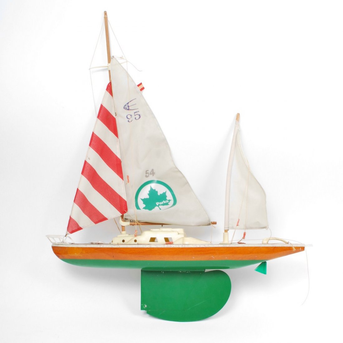 Steve Rubell's Model Sailboat, Photos +: Additional Information & Circa: Steve Rubell's model sailboat. Five photographs of Steve Rubell sailing model sailboat in Central Park reservoir. Letter from New York City Parks Commissioner Gordon J.