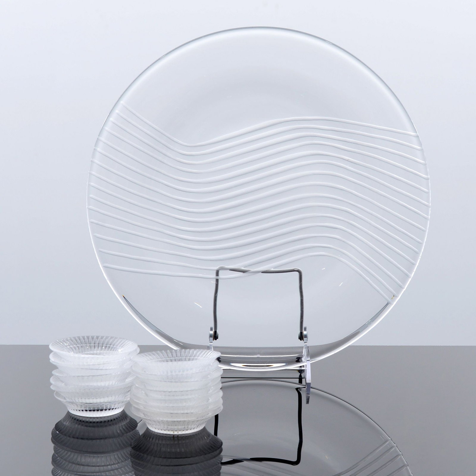 15 Lalique BOURGUEIL Salt / Butter Pat Dishes & 1 Lalique LEDA Platter: Artist/Designer; Manufacturer: Lalique (France) Marking(s); notes: signed, marking(s) Materials: glass Dimensions (H, W, D): charger: .75"h