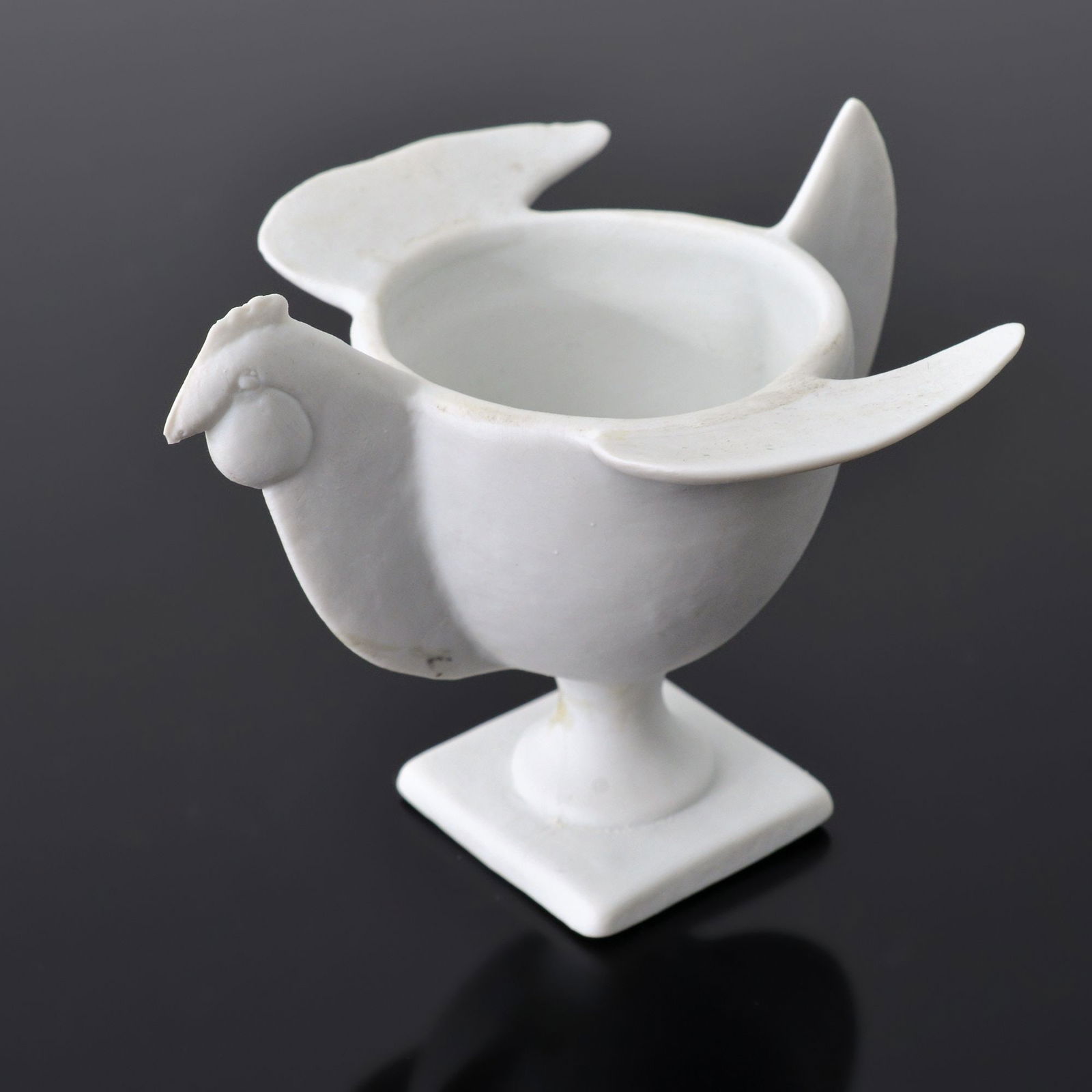 Francois-Xavier Lalanne COQUETIER POULE Egg Cup: Artist/Designer; Manufacturer: Francois-Xavier Lalanne (French, 1927-2008); Artoria Limoges (France)Marking(s); notes: signed, marking(s)Materials: porcelain