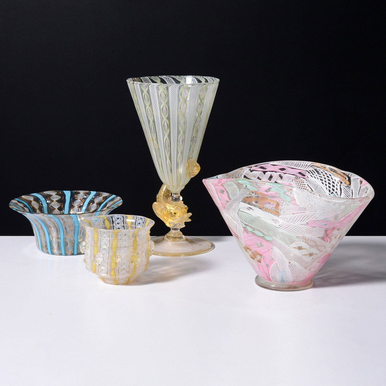 4 Murano Vessels, Manner of Salviati: Artist/Designer; Manufacturer: Salviati, manner of Marking(s); notes: marking(s) (1) Materials: glass Dimensions (H, W, D): largest: 8"h, 4.25"d