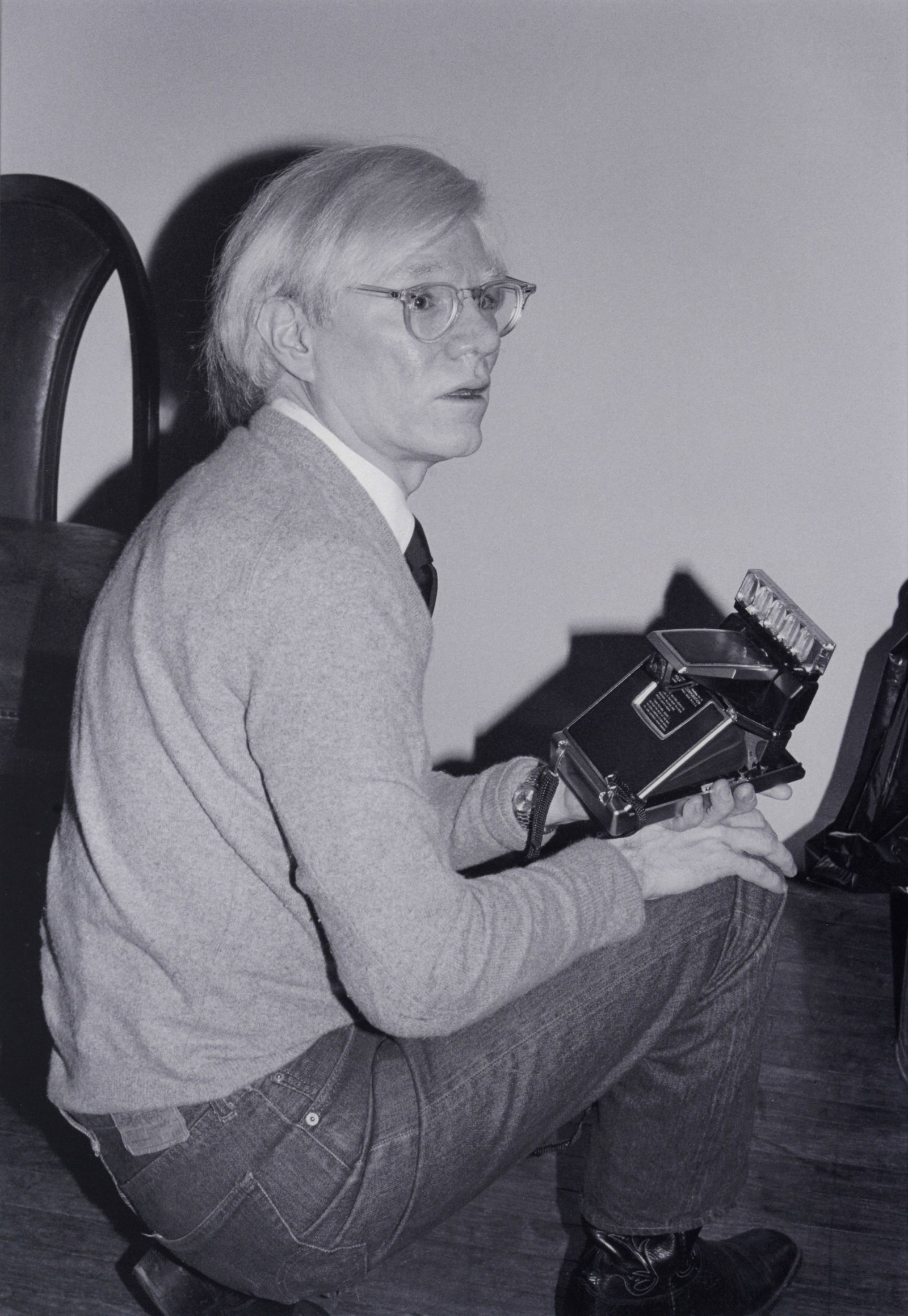 Bobby Grossman ANDY WARHOL WITH POLAROID SX70, THE FACTORY C-Print: Artist/Designer; Manufacturer: Bobby Grossman (American, 1940-2018)Marking(s); notes: marking(s); 1979Materials: chromogenic print on PlexiglasDimensions (H, W, D):