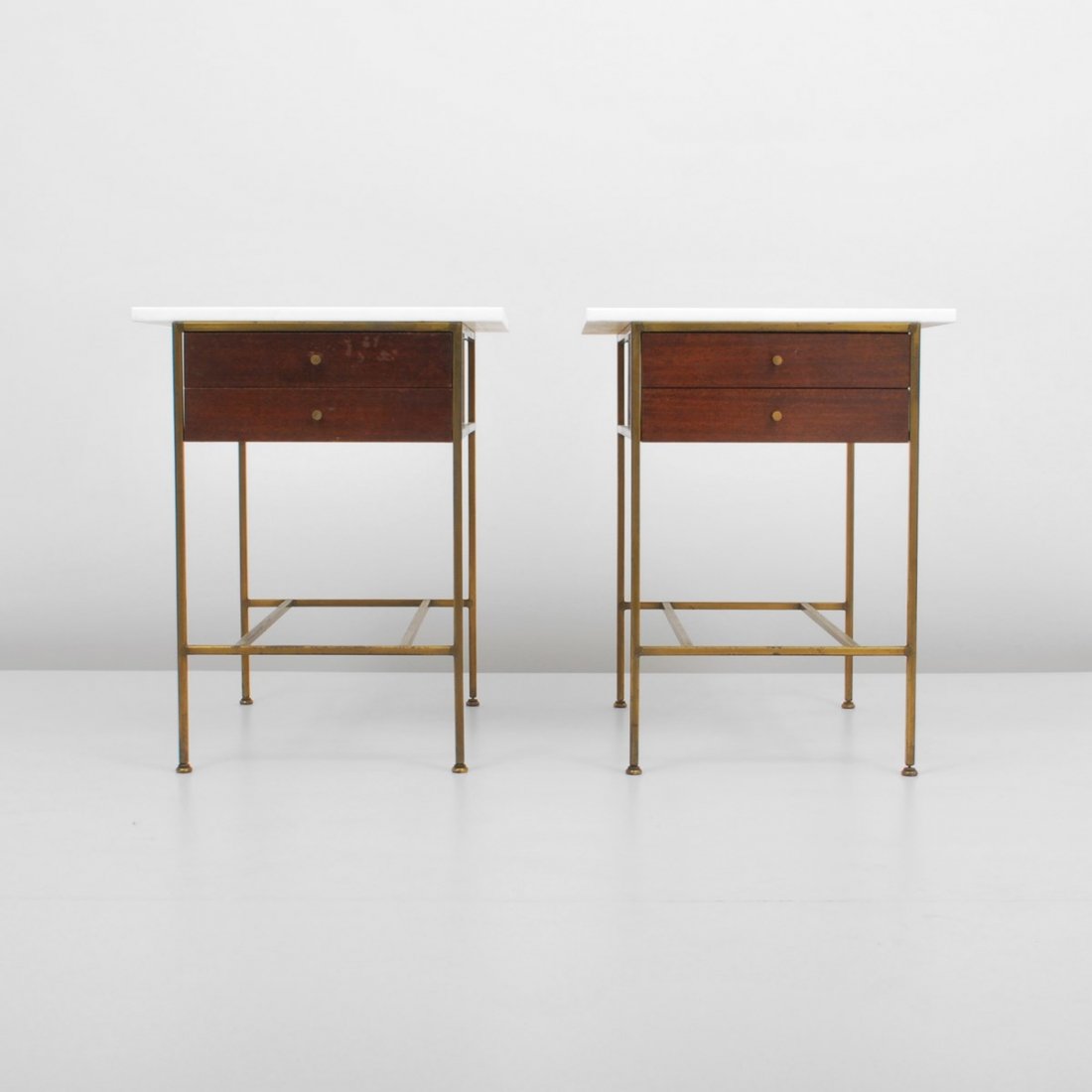 Pair of Paul McCobb Nightstands/End Tables: Designer & Manufacturer: Paul McCobb; Calvin Markings: marked Country of Origin & Materials: USA; brass, glass, wood Additional Information & Circa: Pair of two drawer nightstands/end tables from the 