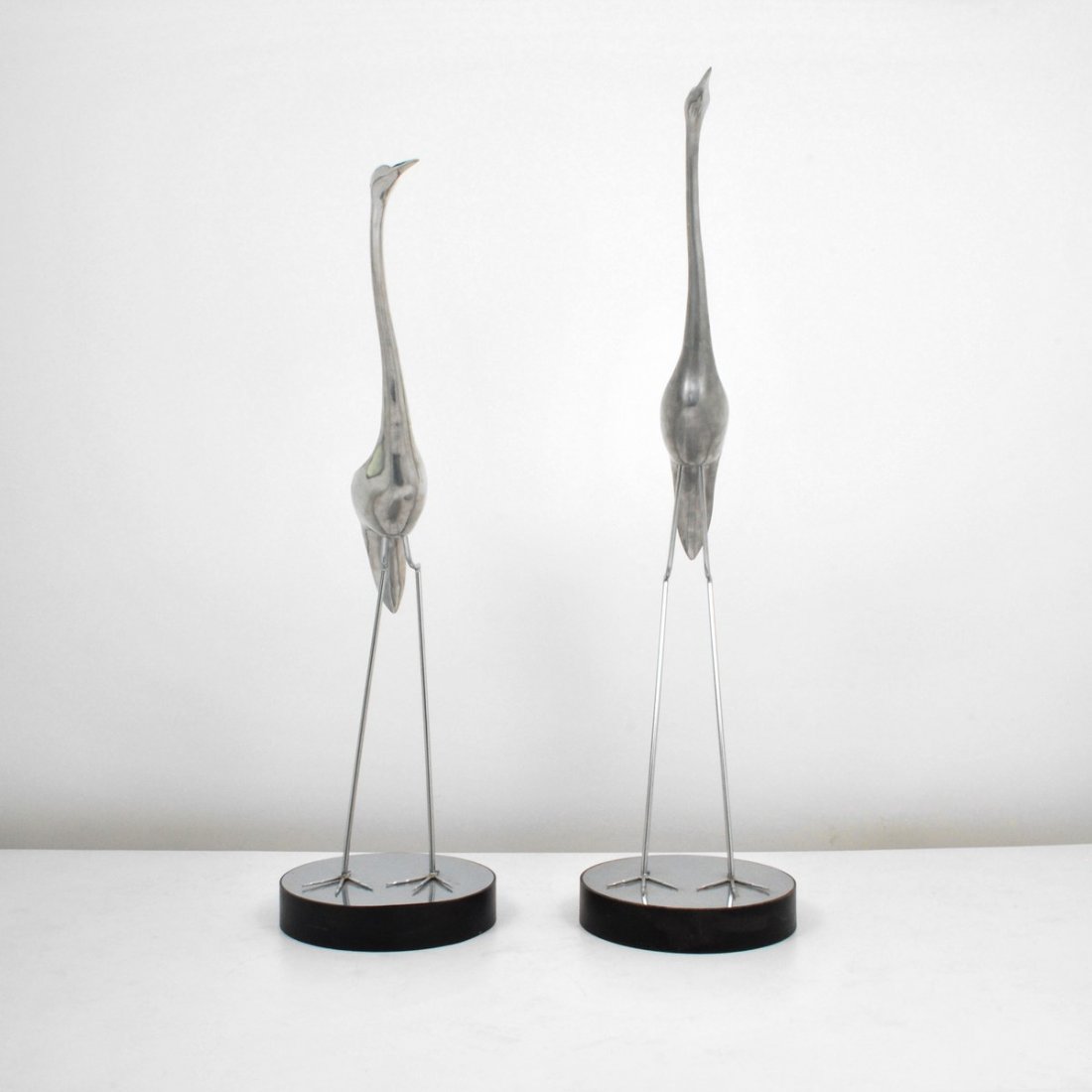 Monumental Pair of Curtis Jere Cranes: Designer & Manufacturer: Curtis Jere; Artisan House Markings: none Country of Origin & Materials: USA; aluminum, metal Additional Information & Circa: Pair of monumental crane sculptures by Curtis Jer
