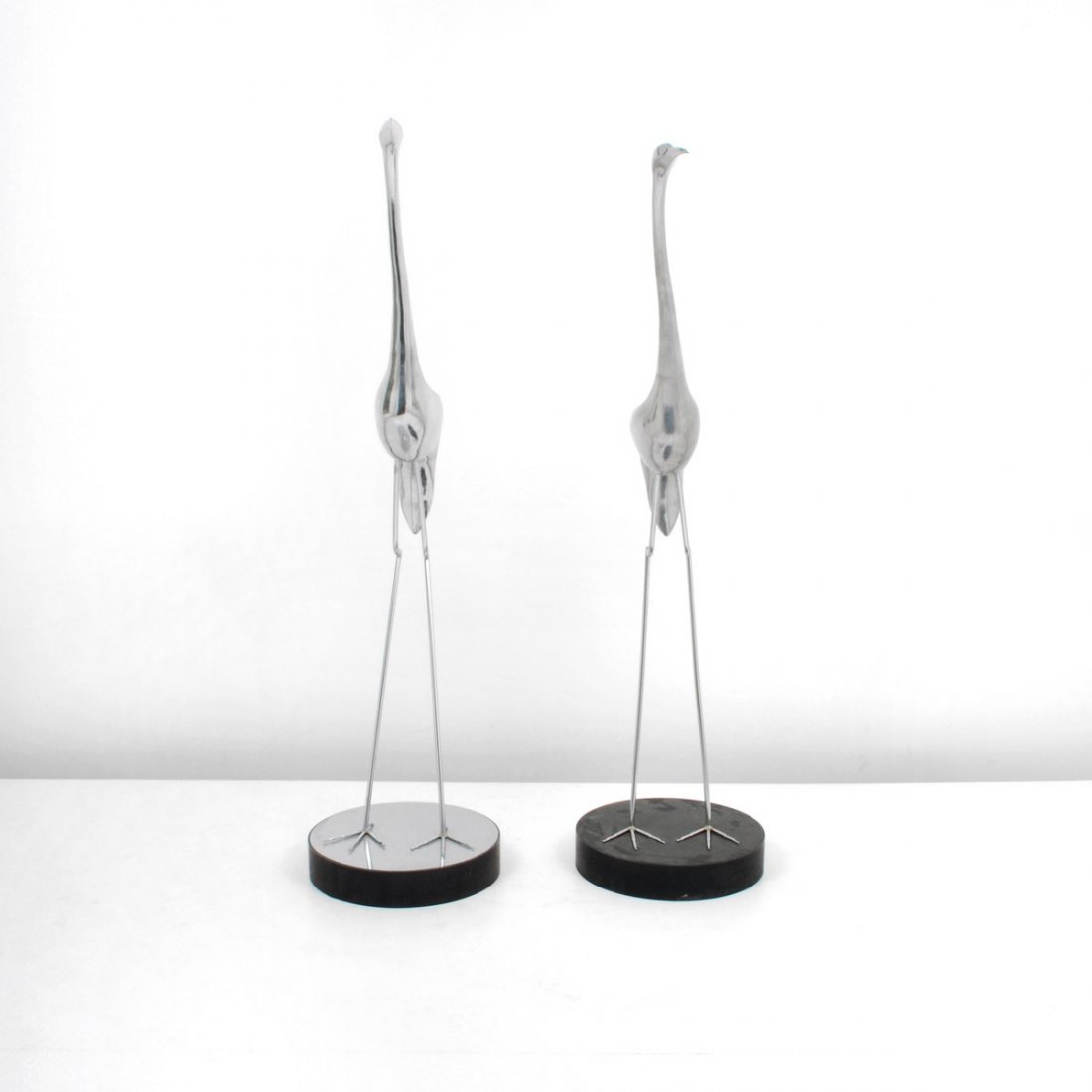 Monumental Pair of Curtis Jere Cranes: Designer & Manufacturer: Curtis Jere; Artisan House Markings: none Country of Origin & Materials: USA; aluminum, metal Additional Information & Circa: Pair of monumental crane sculptures by Curtis Jer