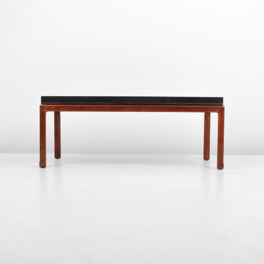 Tommi Parzinger Cocktail Table: Designer & Manufacturer: Tommi Parzinger; Charak Markings: none Country of Origin & Materials: USA; wood, leather Additional Information & Circa: Stamped leather cocktail table by Tommi Parzinger; c. 