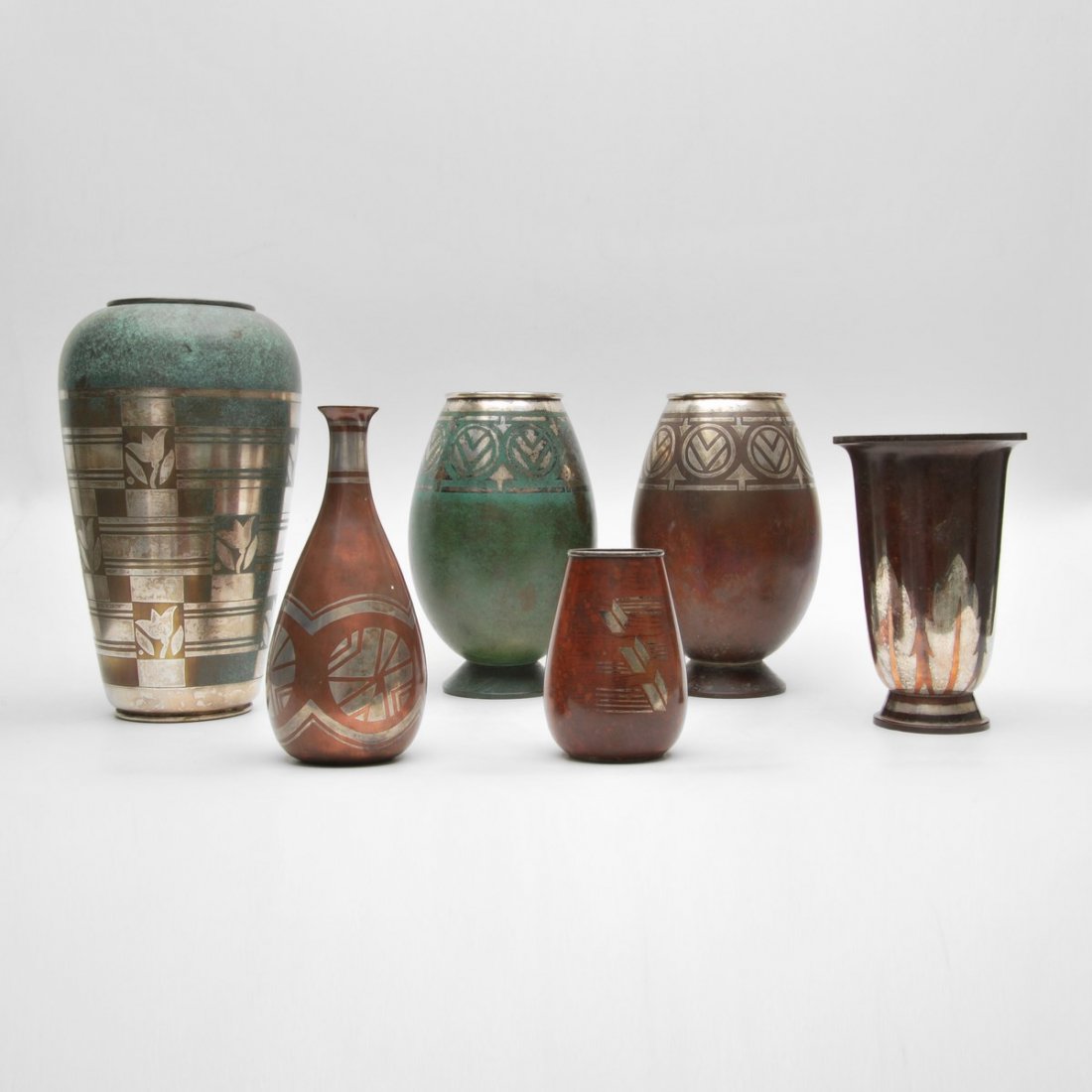 Christofle Vases, Set of 6: Designer & Manufacturer: Christofle Markings: marked Country of Origin & Materials: France; metal Additional Information & Circa: Set of six Art Deco vases with geometric designs by Christofle; c. 193