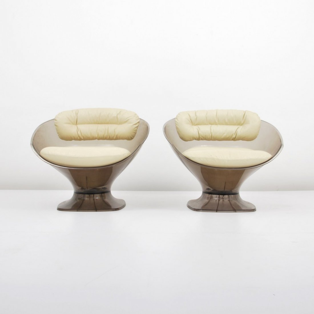 Pair of Raphael Lounge Chairs: Designer & Manufacturer: Raphael Markings: none Country of Origin & Materials: France; plastic, leather Additional Information & Circa: Pair of leather lounge chairs by Raphael; c. 1980 (Key Word Sear