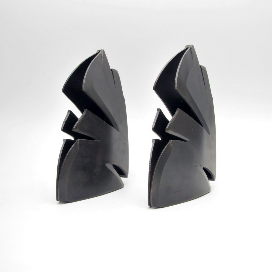 Albert Paley Bookends: Designer & Manufacturer: Albert Paley; Albert Paley Studio Markings: marked; dated Country of Origin & Materials: USA; steel Additional Information & Circa: Pair of modernist bookends by noteworthy sc
