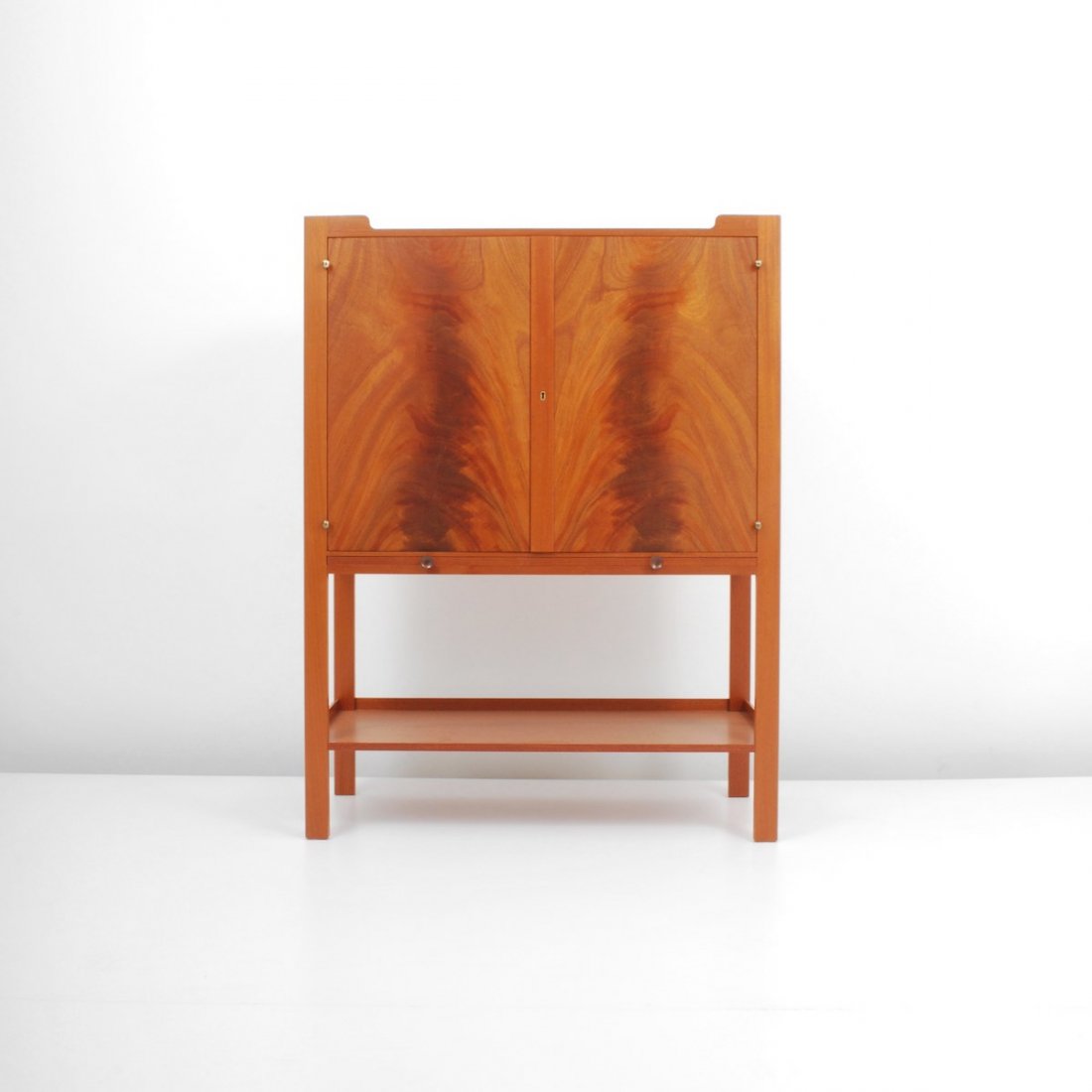 Josef Frank Cabinet: Designer & Manufacturer: Josef Frank; Svenskt Tenn Markings: marked Country of Origin & Materials: Sweden; wood, metal Additional Information & Circa: Finely crafted cabinet with two doors revealing t