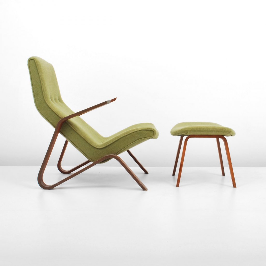 Early Eero Saarinen "Grasshopper" Chair & Ottoman: Designer & Manufacturer: Eero Saarinen; Knoll Associates Markings: marked Country of Origin & Materials: USA; wood, upholstery Additional Information & Circa: Early "Grasshopper" lounge chair and otto