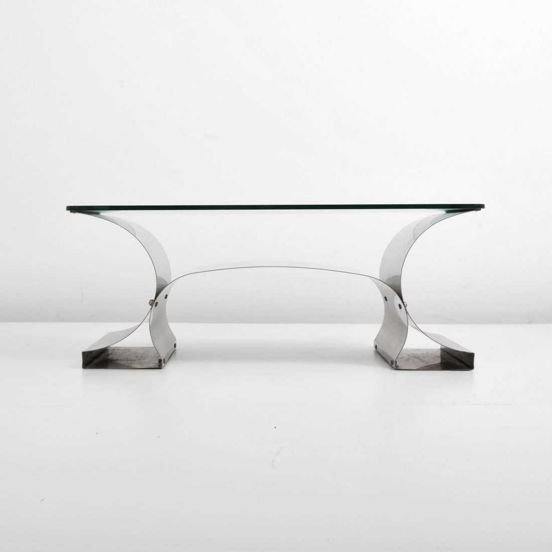François Monnet Cocktail Table: Designer & Manufacturer: François Monnet; Kappa Markings: none Country of Origin & Materials: France; stainless steel, glass Additional Information & Circa: Stainless steel cocktail table by Françoi