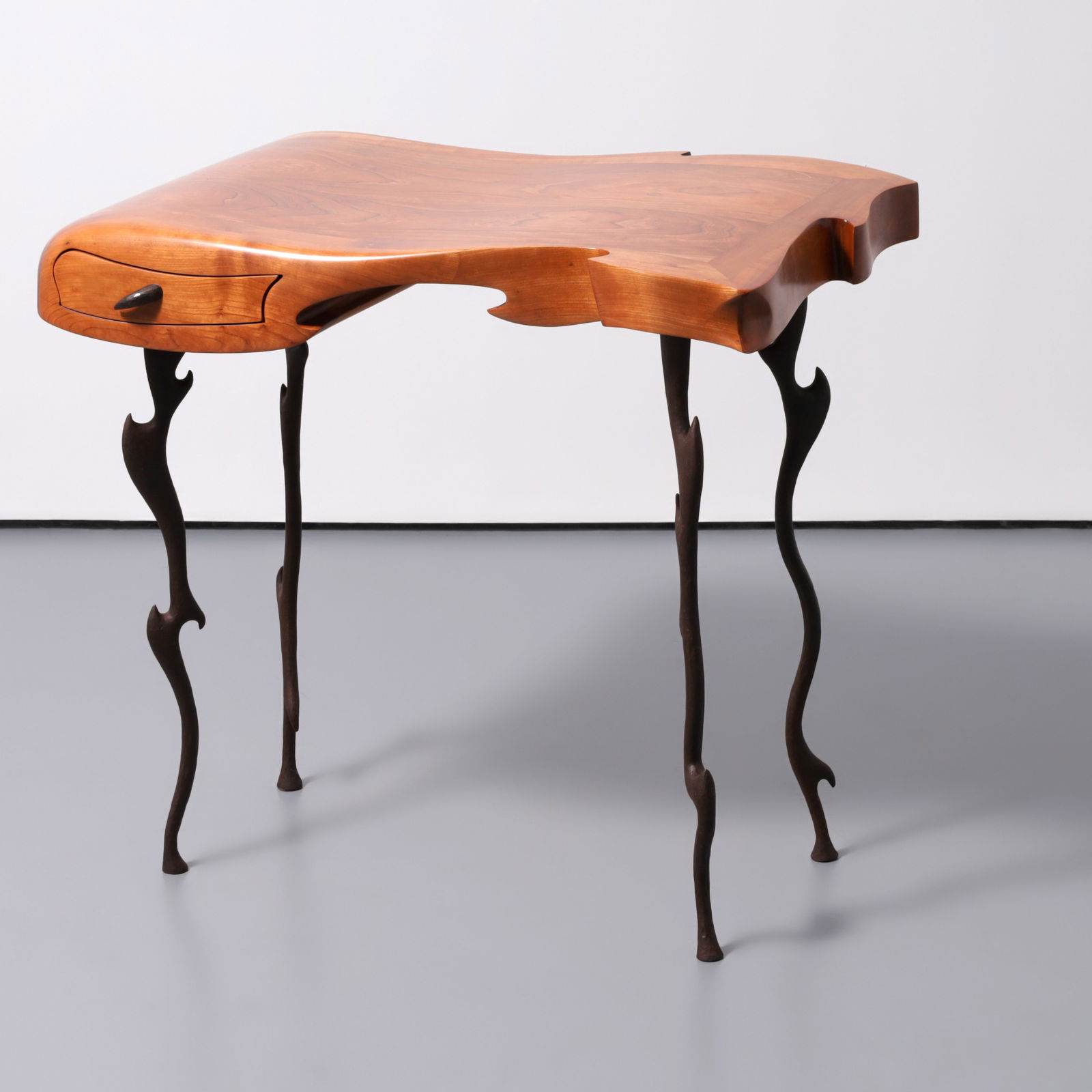Desk, Manner of Wendell Castle: Artist/Designer; Manufacturer: Wendell Castle, manner ofMarking(s); notes: no marking(s) apparentMaterials: wood, wrought ironDimensions (H, W, D): 30&