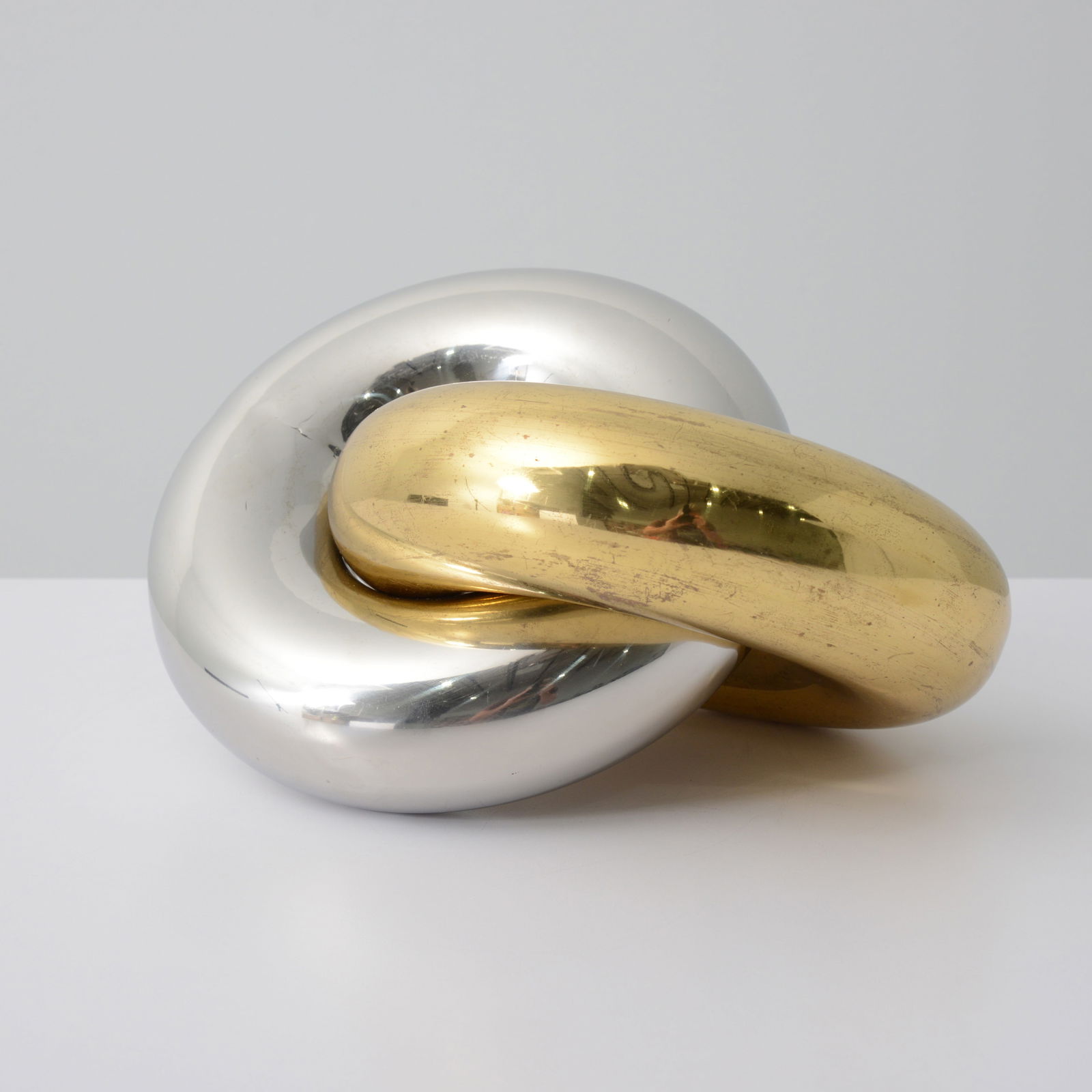 Large Knot Sculpture, Manner of Anish Kapoor: Artist/Designer; Manufacturer: Anish Kapoor (British/Indian, b. 1954), manner ofMarking(s); notes: no marking(s) apparentMaterials: chromed metal, brassDimensio