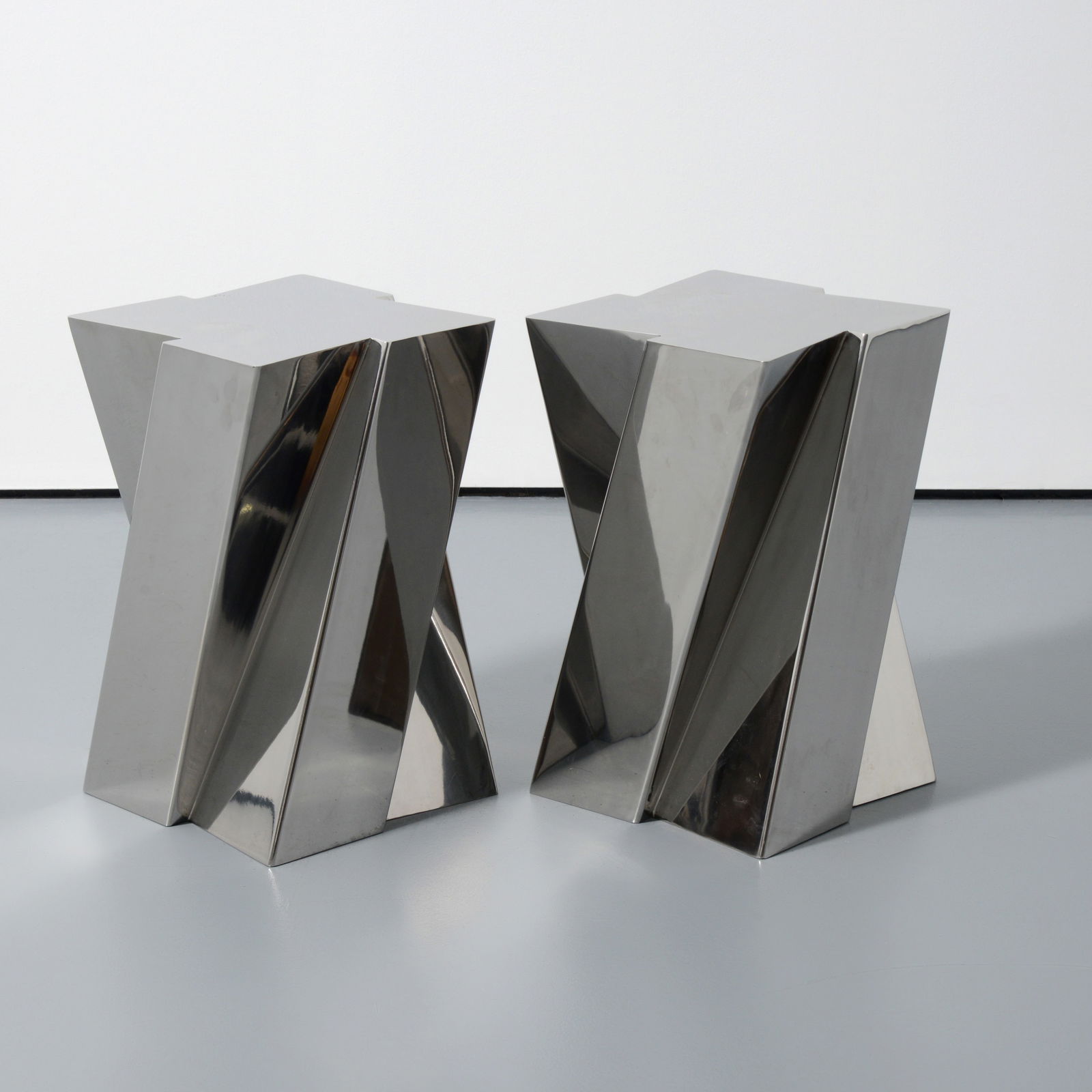 Pair of Philippe Hurel ZIGI Occasional / End Tables: Artist/Designer; Manufacturer: Philippe Hurel (French, 20th Century); Sutherland (USA)Marking(s); notes: Sutherland imprintMaterials: stainless steelD