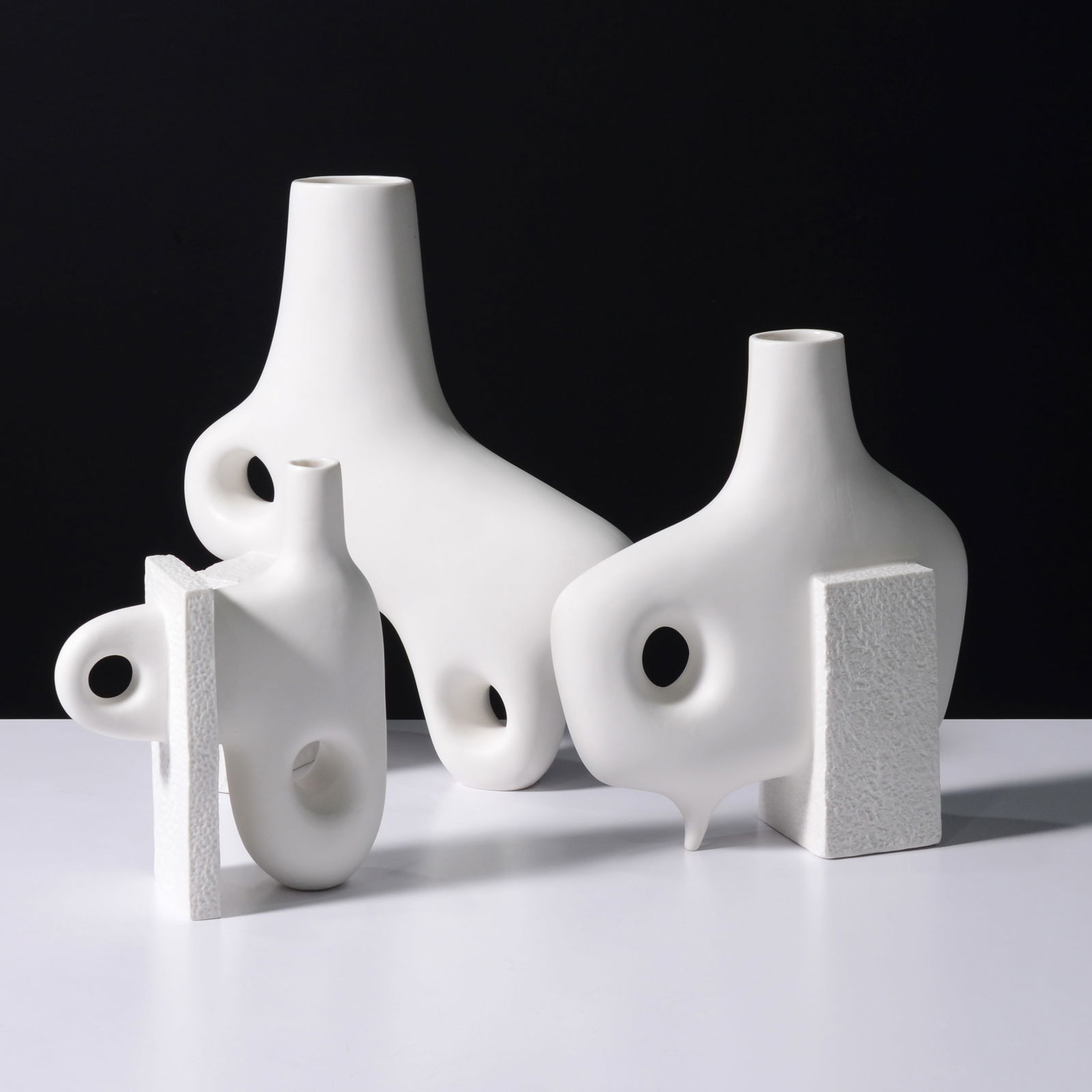 Jonathan Adler PARADOX Vases / Vessels, Set of 3: Artist/Designer; Manufacturer: Jonathan Adler (American, b. 1966)Marking(s); notes: signed (3), label (3)Materials: unglazed ceramicDimensions (H, W, D):&n