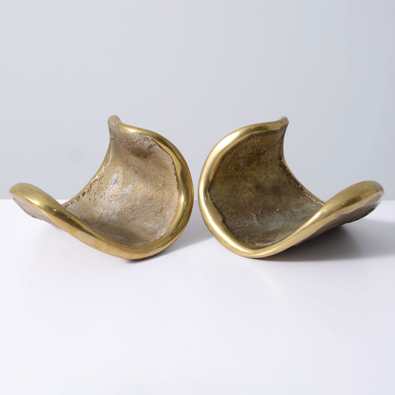 Large Jaimal Odedra Bronze Bookends: Artist/Designer; Manufacturer: Jaimal Odedra (British, 20th Century)Marking(s); notes: signedMaterials: sand-casted and polished bronzeDimensions (H, W, D)