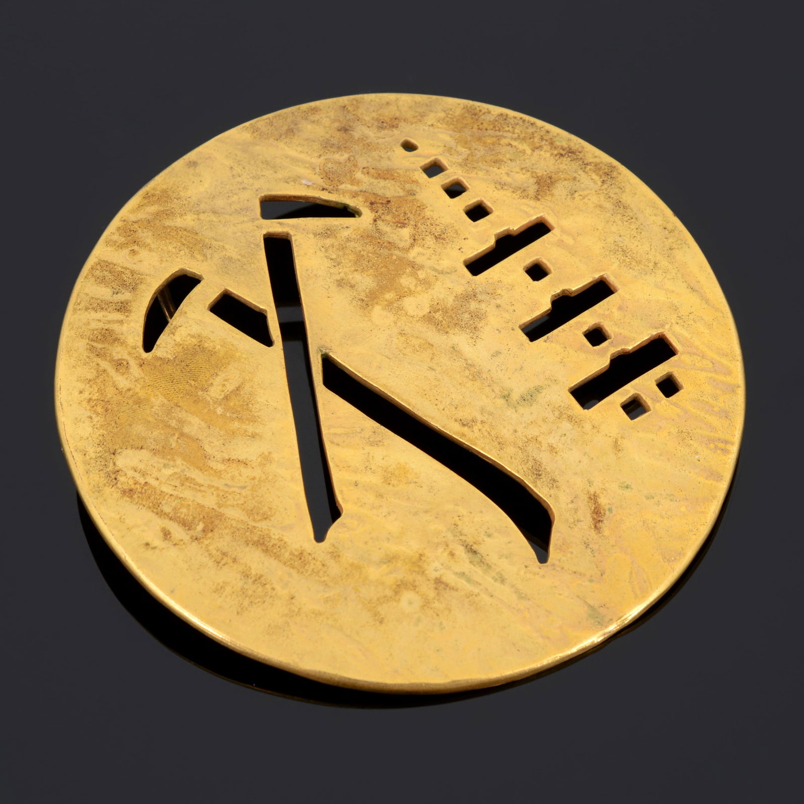 Mary McFadden Buckle / Pendant: Artist/Designer; Manufacturer: Mary McFadden (American, 1938-2024)Marking(s); notes: signed, marking(s)Materials: metalDimensions (H, W, D): 3.5"dia