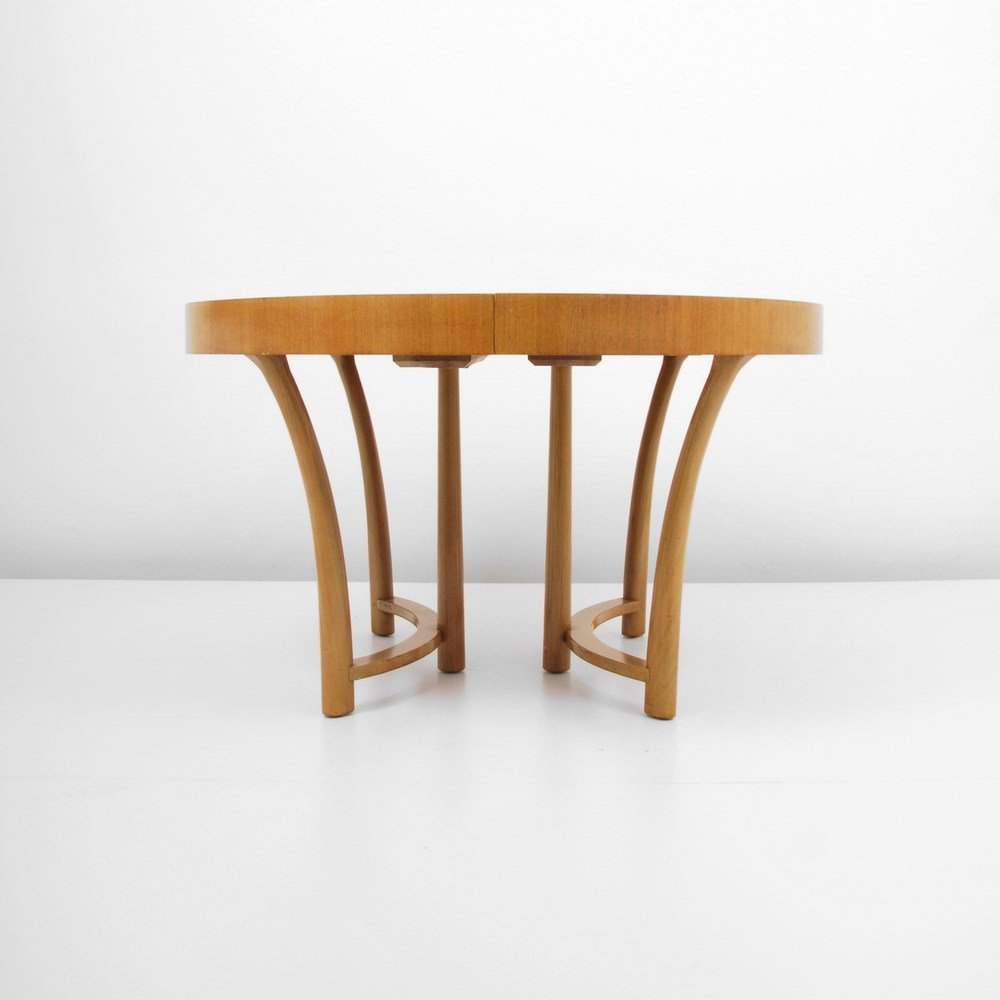 T.H. Robsjohn-Gibbings Dining Table: Designer & Manufacturer: T.H. Robsjohn-Gibbings; Widdicomb Markings: marked Country of Origin & Materials: USA; mahogany Additional Information & Circa: Dining table with starburst veneer and three 12