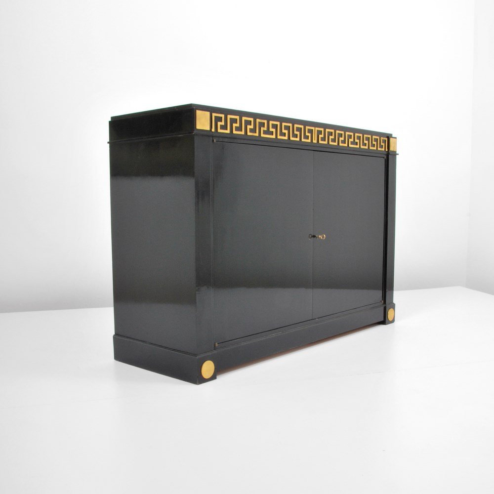 Andre Arbus Cabinet, Greek Key Detailing: Designer & Manufacturer: Andre Arbus Markings: none Country of Origin & Materials: France; ebonized wood, bronze, marble Additional Information & Circa: Fine cabinet with two doors revealing shelves a