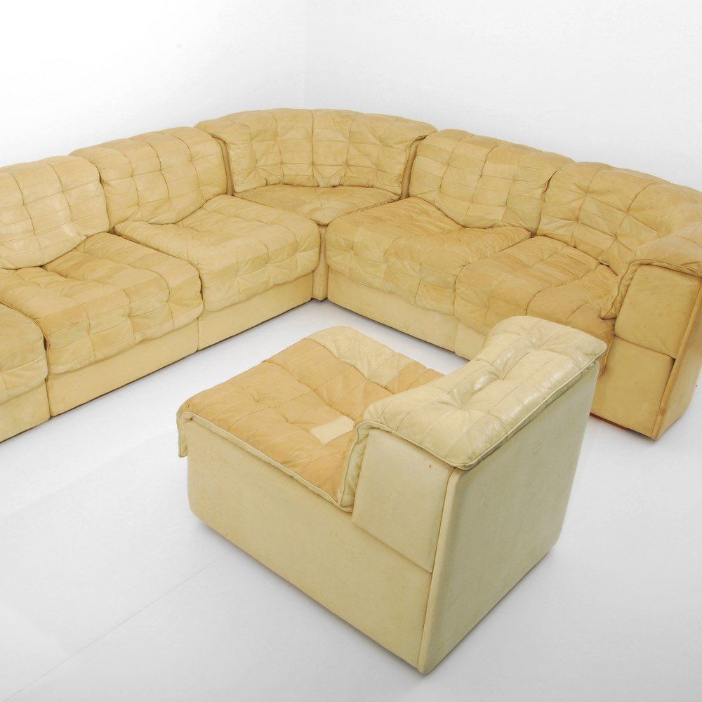 DeSede Sectional Sofa: Designer & Manufacturer: DeSede Markings: marked Country of Origin & Materials: Switzerland; leather, wood Additional Information & Circa: Sofa comprised of eight sections which can be configured in a
